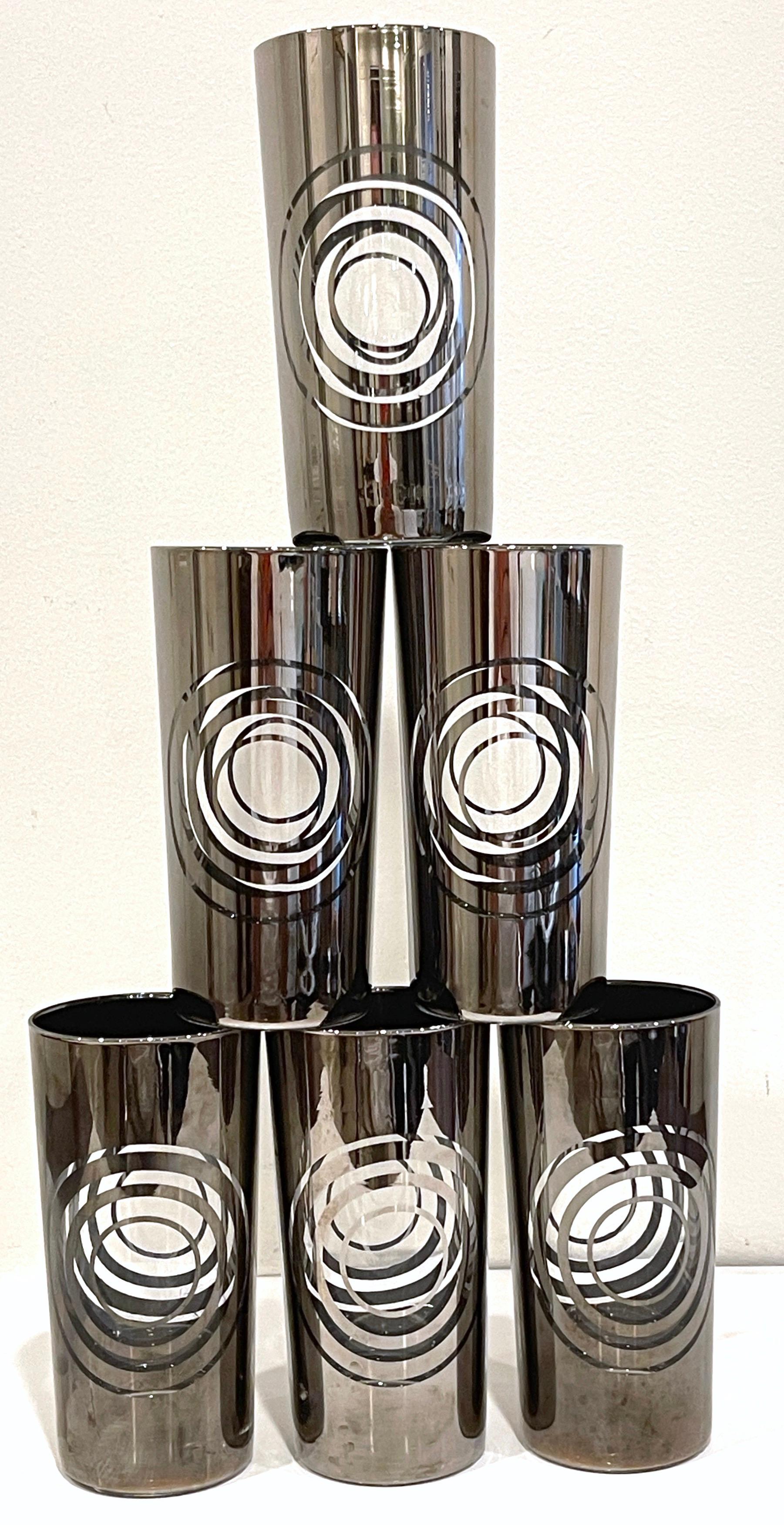 Set of Six 1970s Silvered MOD Highball Glasses 
USA, 1970s

This set of six silvered MOD highball glasses from the 1970s is a fantastic representation of unique and reflective Mid Century barware. These glasses have a distinctive quality akin to