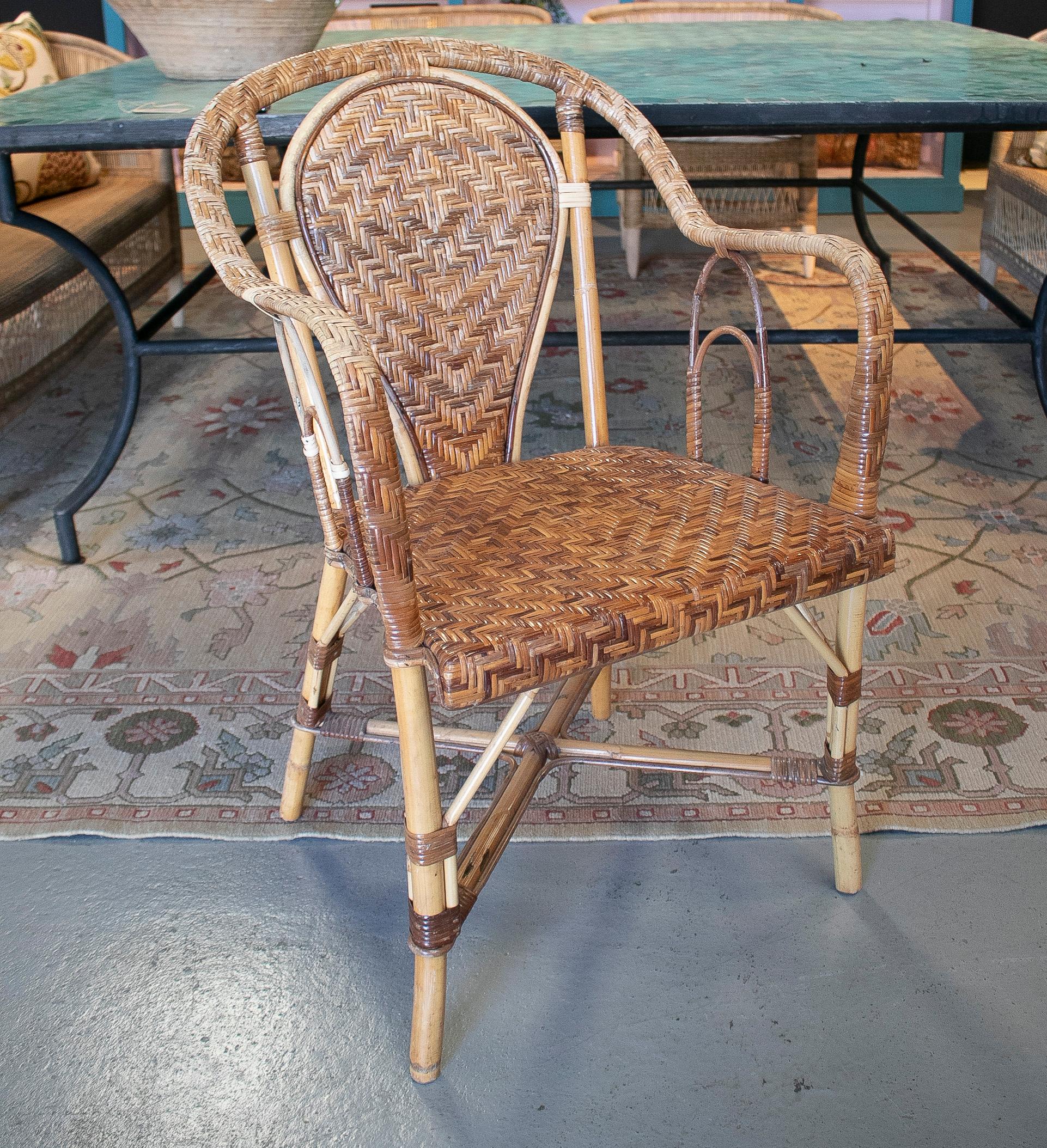 Set of six vintage 1970s Spanish hand woven wicker on cane garden chairs.
