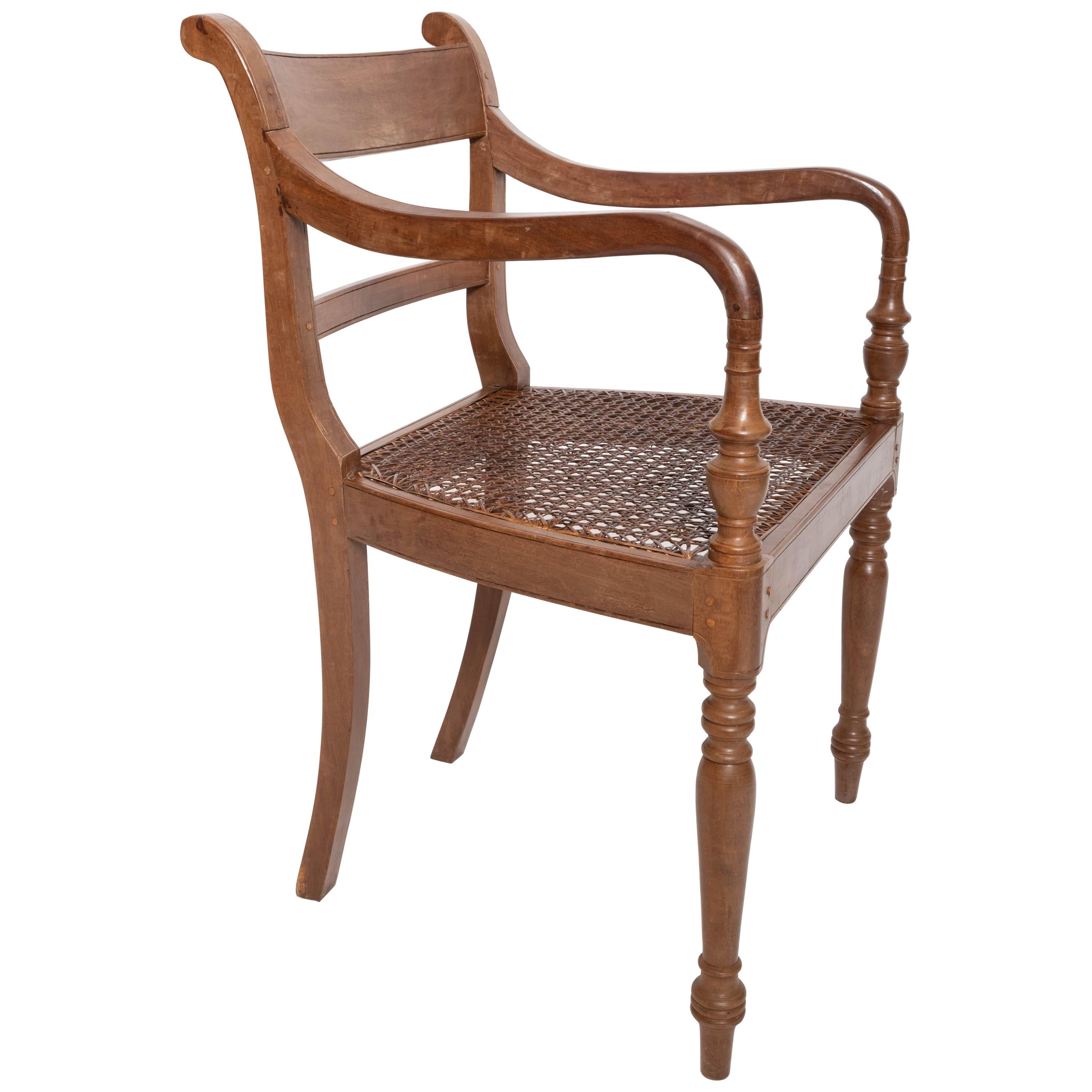 Set of six Ceylonese dining chairs, peg construction, hand carved and hand caned. Solid and very comfortable.