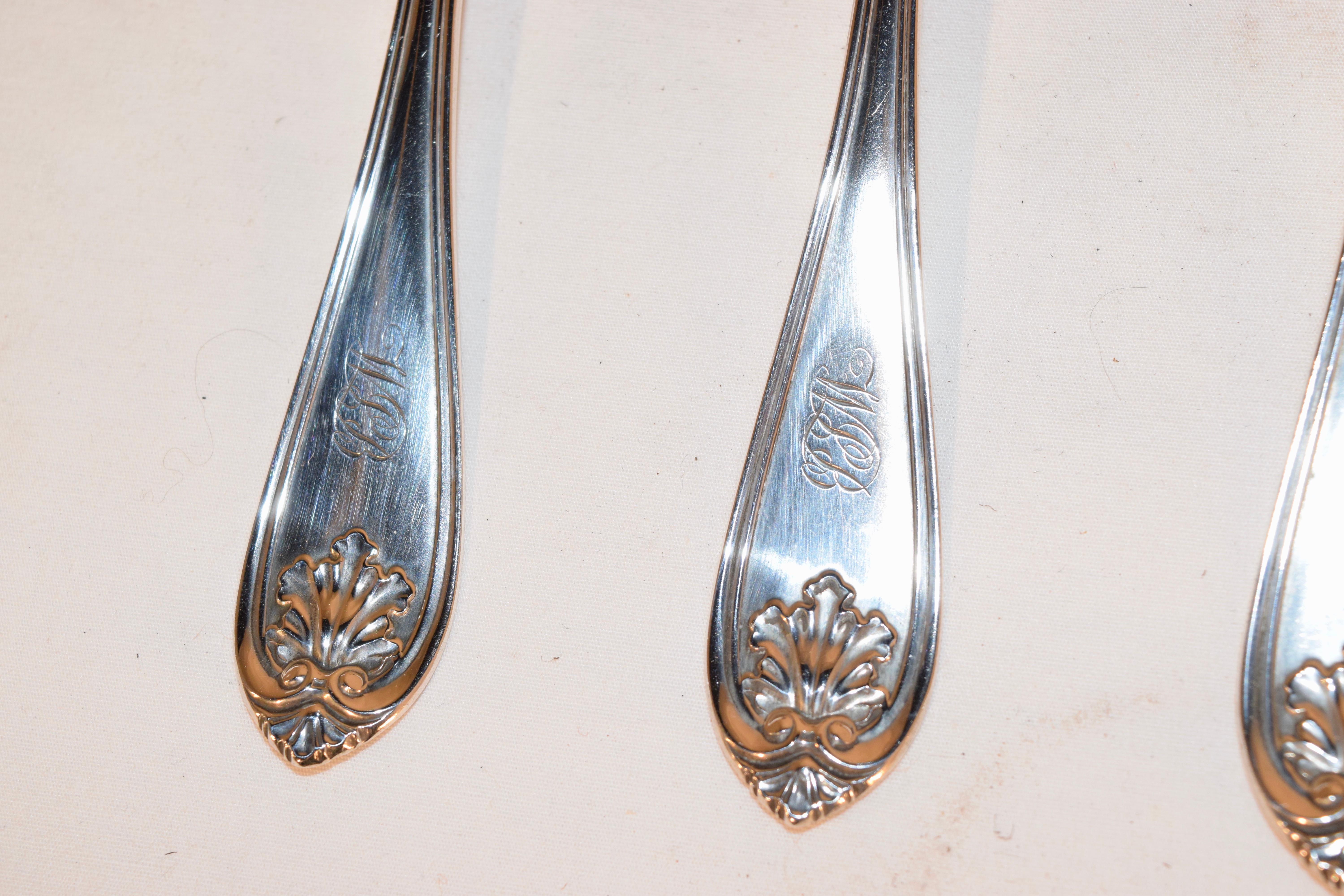 Set of six coin silver spoons circa 1855 in the shell pattern. They are marked JT & 
EM Edwards, which was in Chicago. The spoons are monogrammed on the handles appear to be WSB or WJB.