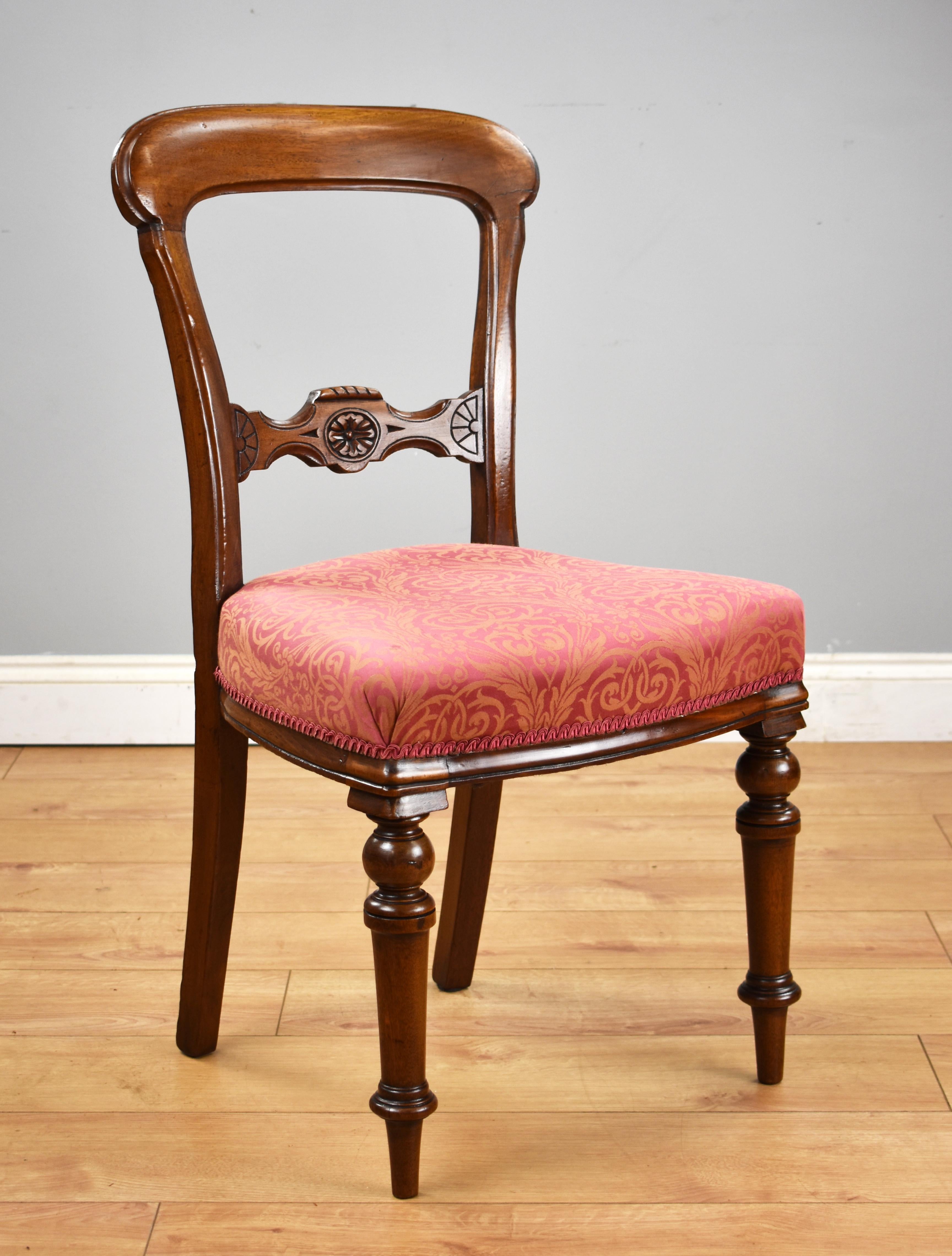 For sale is a good quality set of 6 Victorian mahogany dining chairs, having a carved back rail above an upholstered seat, standing on elegantly turned legs. All of the chairs are structurally sound with no loose joints and remain in very good