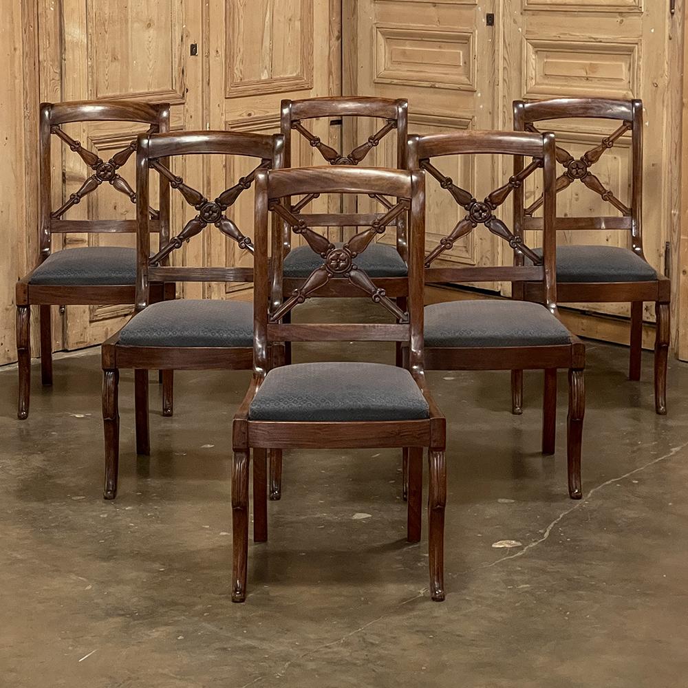 Set of six 19th century French Charles X walnut dining chairs represent yet another example of the incredible amount of style revivals that occurred during and after the reign of Napoleon III. Hand-crafted from fine French walnut, each chair
