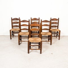 Set of Six 19th Century French Ladderback Walnut Chairs with Rush Seats