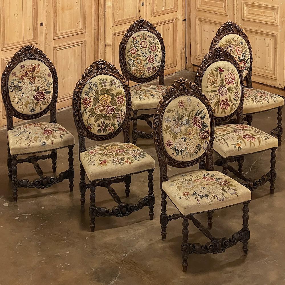 Set of six 19th century French Louis XVI carved dining chairs with original needlepoint are amazing works of the sculptor's and cabinetmaker's arts! Each chair was hand-carved from solid, dense old-growth oak in breathtaking and lifelike full
