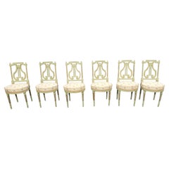 Ensemble de six chaises de salle à manger de style Louis XVI du 19ème siècle peintes en vert et dorées à la feuille