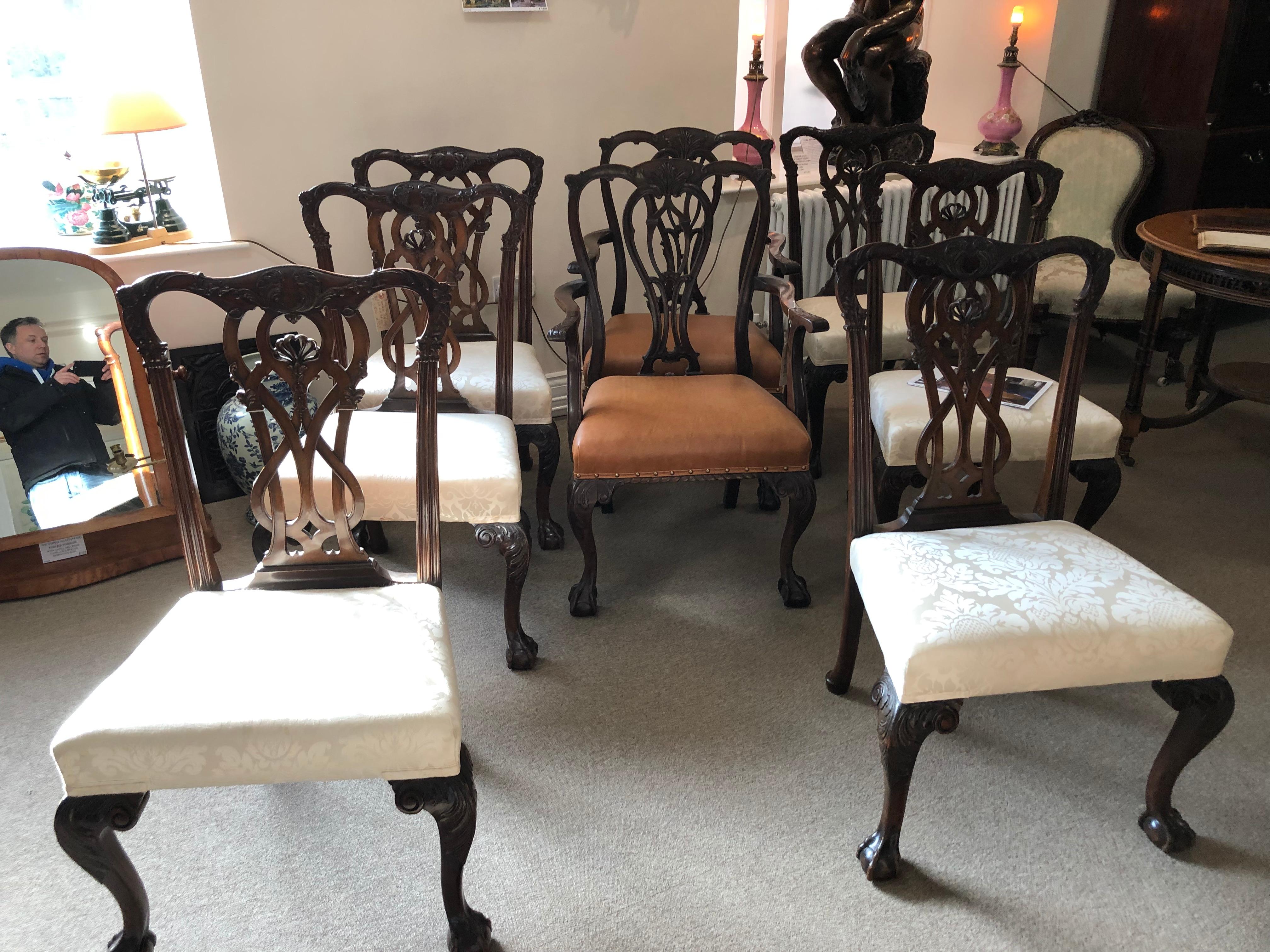 A very handsome set of six solid mahogany beautifully carved Chippendale design 19th century George III style dining chairs on ball and claw feet with damask fabric.
Two very similar carver chairs also available, as pictured.