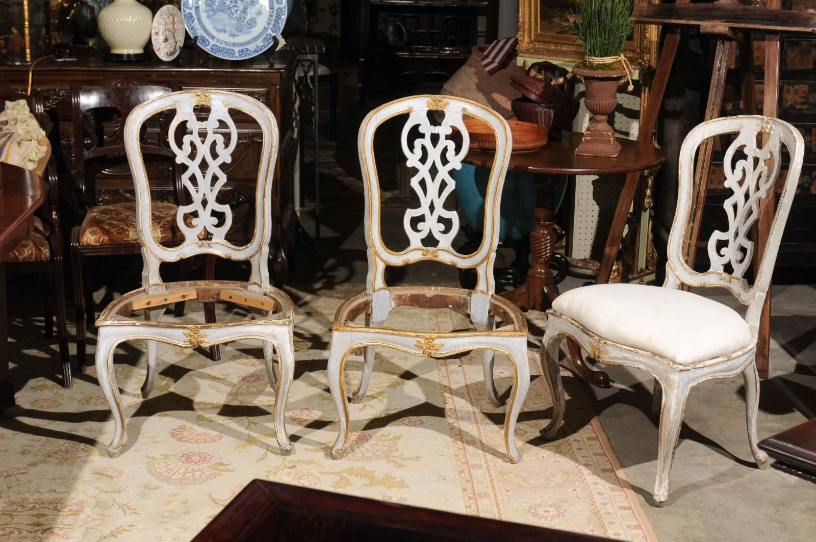 A fabulous set of six 19th century antique painted and gilt dining chairs.
The paint and gilt highlight the hand-carved detail of the chairs. They are supported with cabriole legs. They are structurally in good condition and have just been