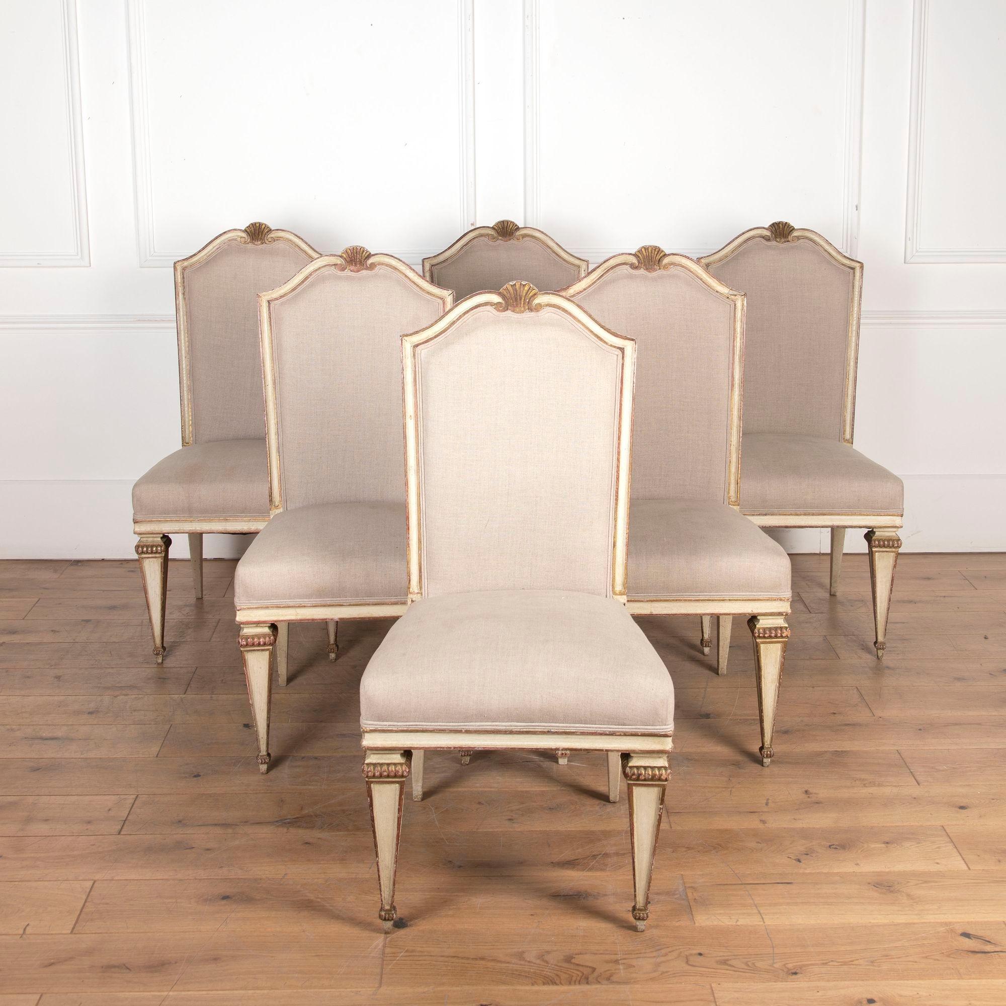 Fantastic set of six French dining chairs, dating to circa 1920.
These chairs are beautifully hand-carved and painted.
A carved scallop shell detail adorns the crest of each chair on the top.
They have been re-upholstered in Swedish linen.