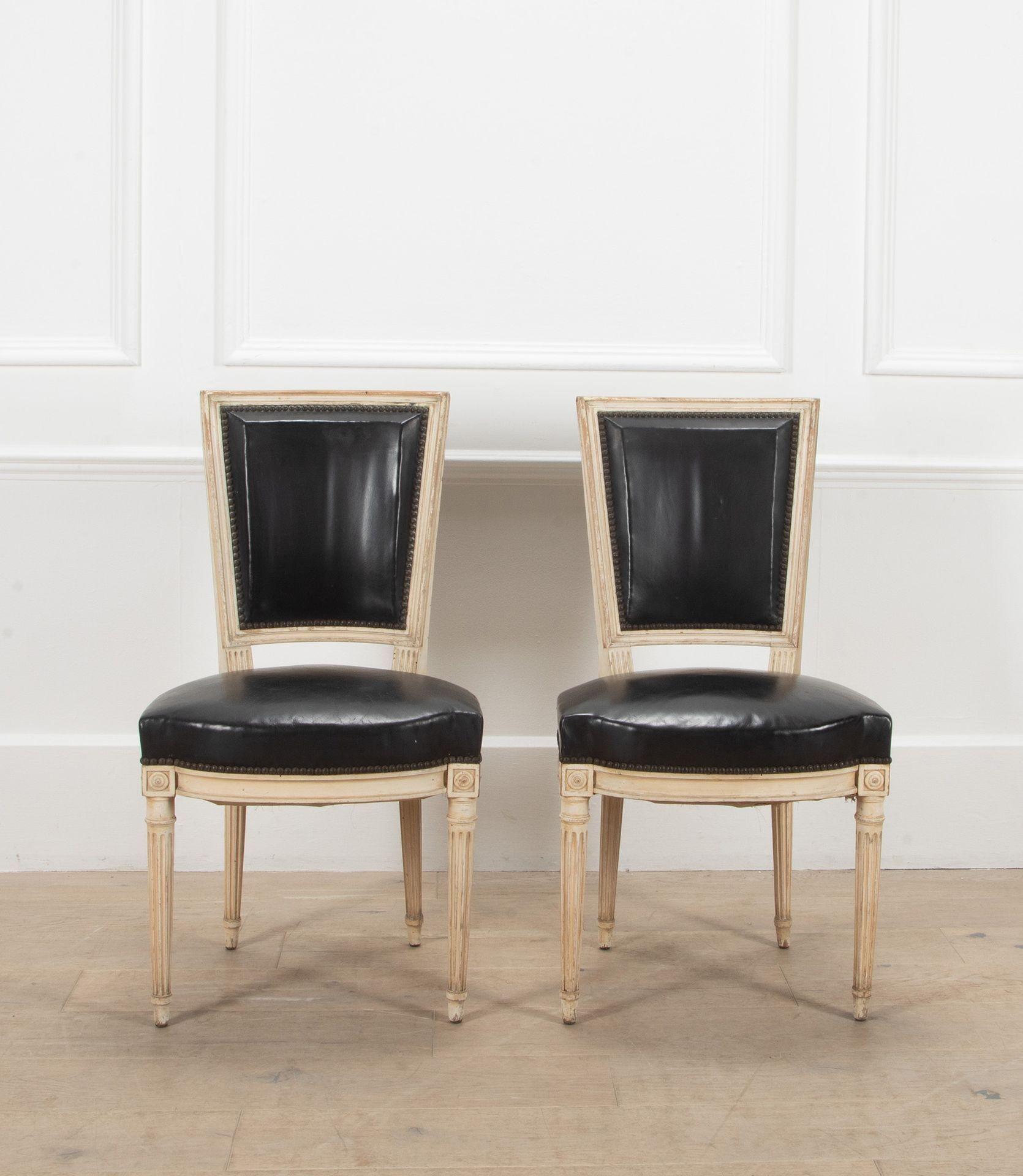 A superb set of six French 20th Century, Maison Jansen, Louis XVI style chairs.
In their original paint and black leather upholstery.
Circa 1950.