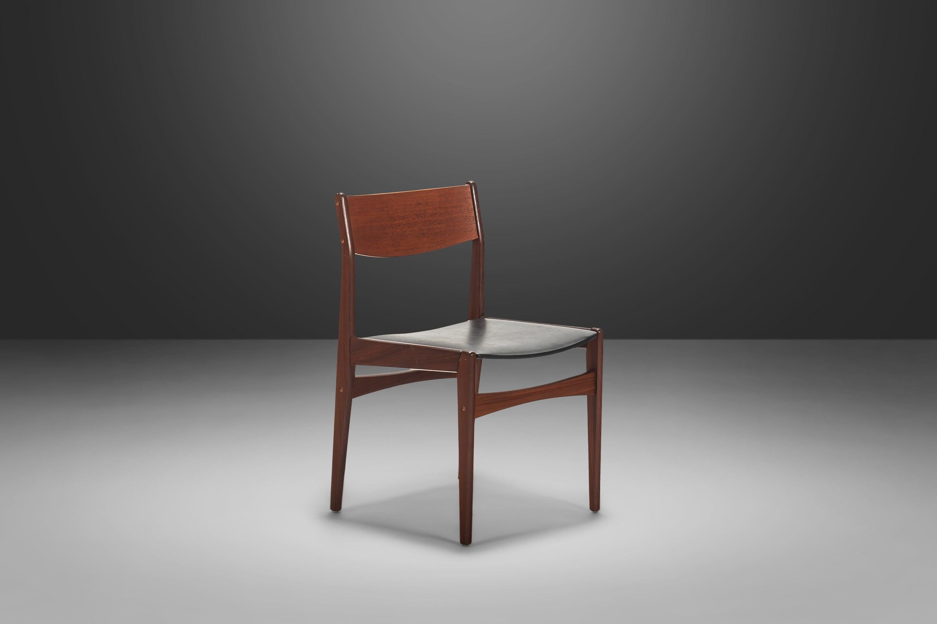 This set of understated dining chairs by Poul Volther are in 100% original, vintage condition and ideal for collectors searching for a completely untouched set of authentic Danish pieces. Constructed of solid teak and original naugahyde seats this