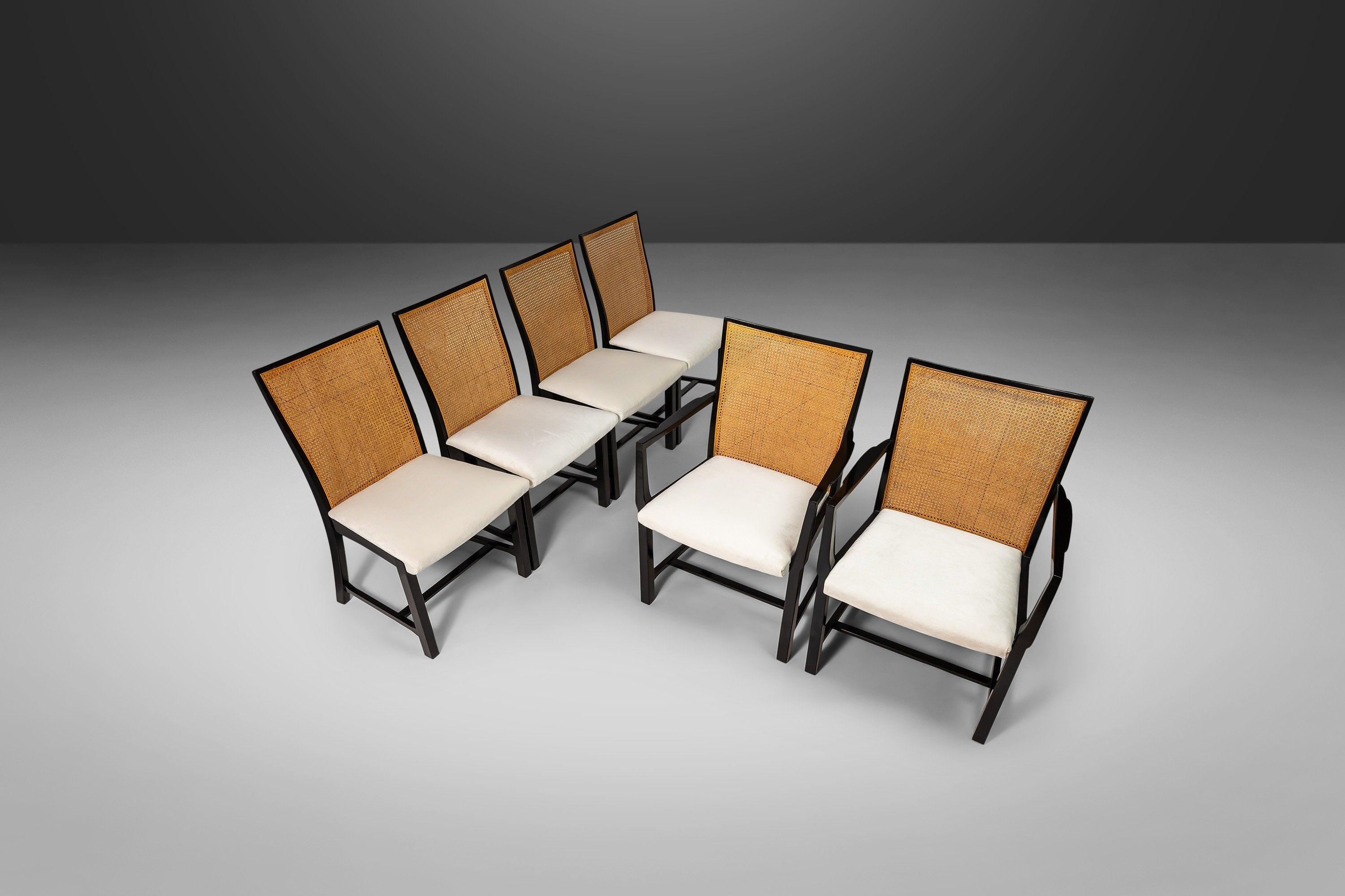 Rare, exceptional, highly collectable, and ready for installation. This set of 6 chairs (4 side chairs and 2 armchairs) is from the New World Collection designed by Michael Taylor for Baker Furniture. The set is masterfully crafted from solid cherry