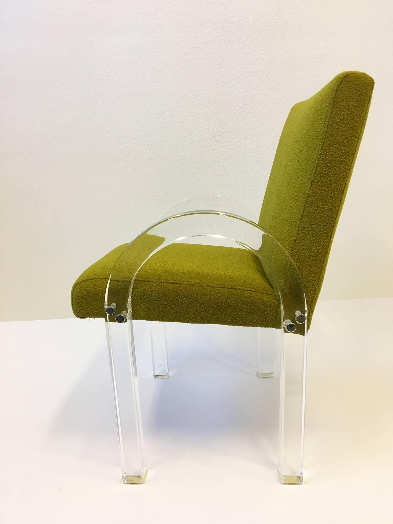 A beautiful set of six clear acrylic dining armchairs by renowned designer Charles Hollis Jones. This are from the 