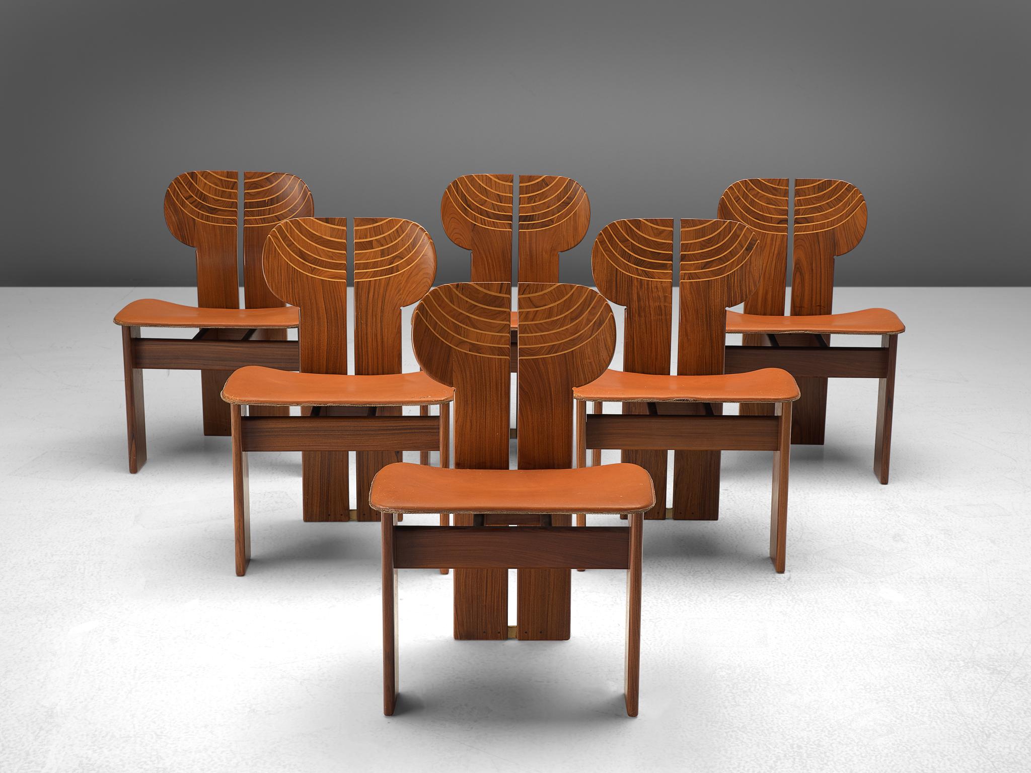 Afra & Tobia Scarpa for Maxalto, set of six dining chairs, cognac leather, walnut and brass, Italy, 1975.

This set of chairs explicitly sculptural grand chairs are by Afra & Tobia Scarpa and are titled 'Africa' being part of the Artona collection
