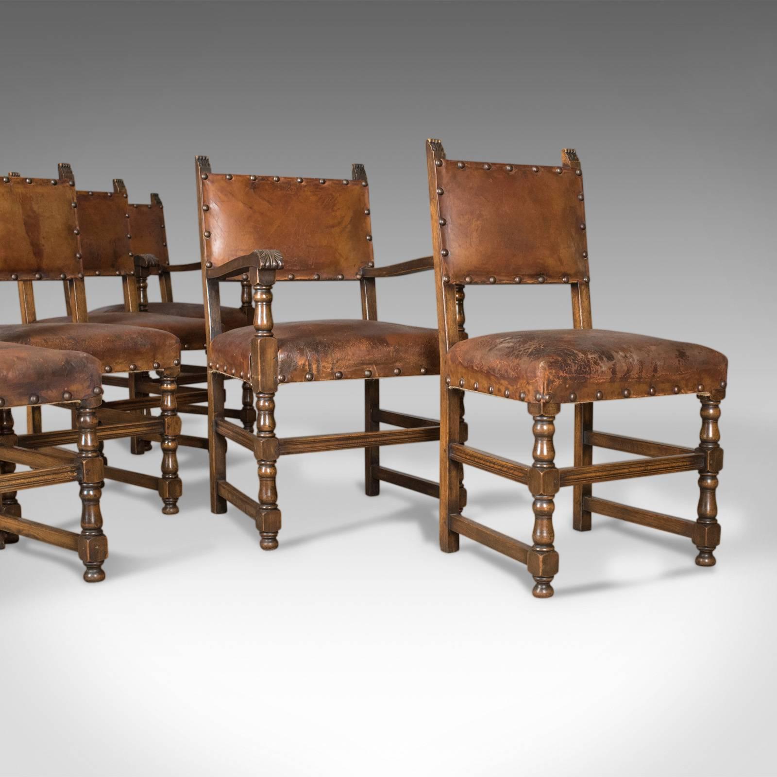 This is a set of six antique dining chairs, Edwardian in the 17th century taste, in English oak and leather.

A pair of carvers plus four side chairs
Sturdy English oak frames with three-quarter stretchers
Displaying good color throughout in a