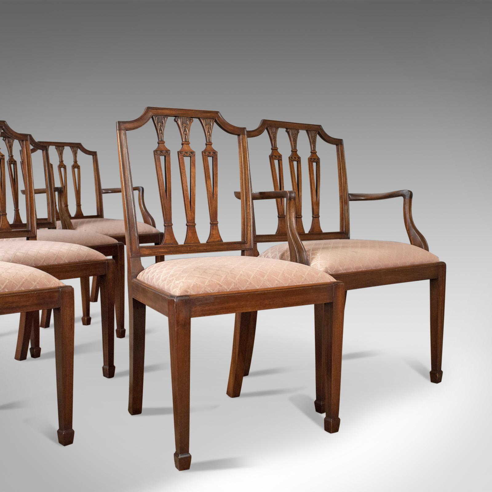 This is a set of six antique dining chairs in mahogany, Victorian Sheraton Revival, English, circa 1900. 

An attractive set of six, English, late 19th century dining chairs
In the desirable form of a pair of carver elbow chairs and four