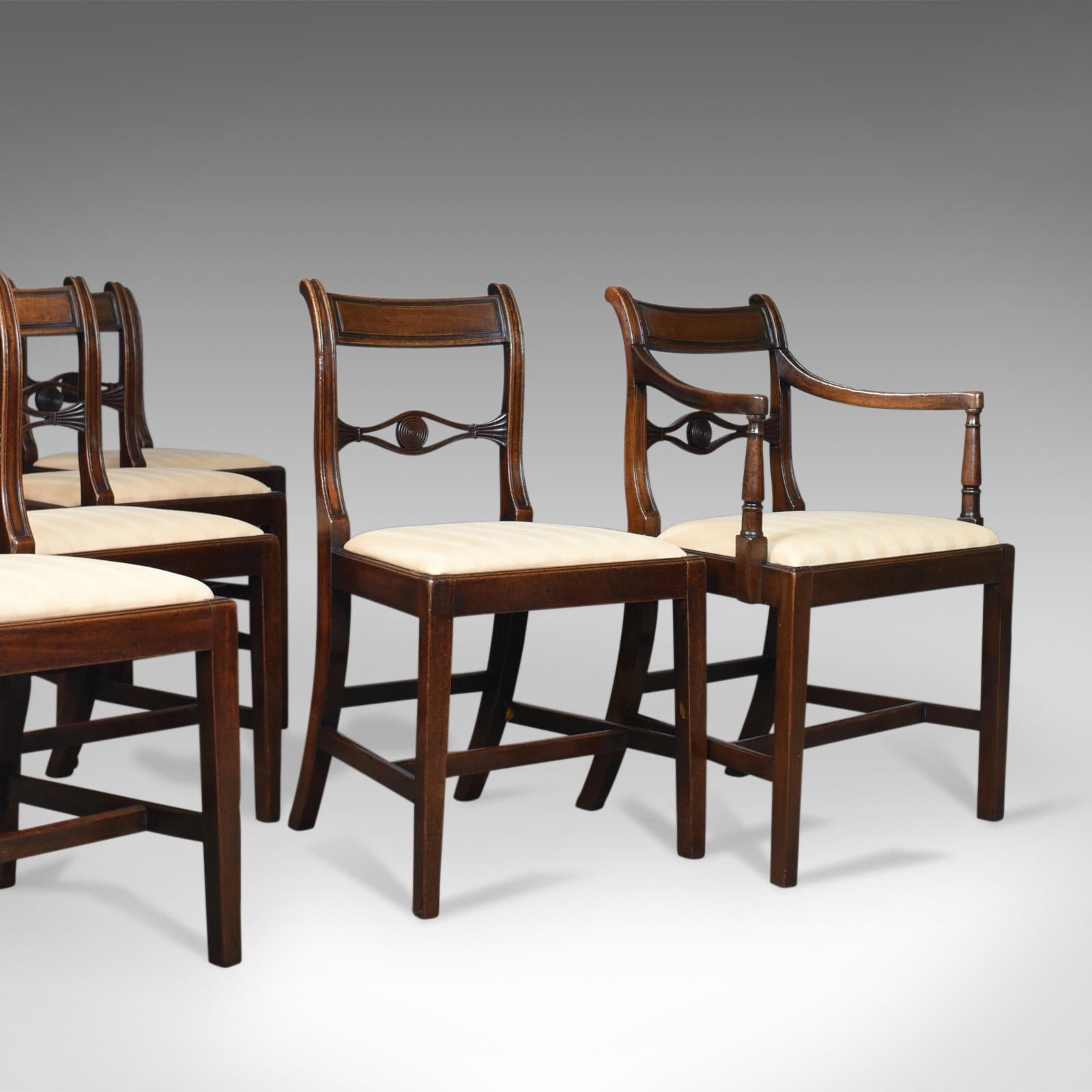 This is a set of six antique dining chairs, 5+1 English, Regency, mahogany chairs dating to the early 19th century, circa 1820. 

A superior set of chairs in select mahogany with a desirable patina
Five side chairs and a single 'father', elbow,