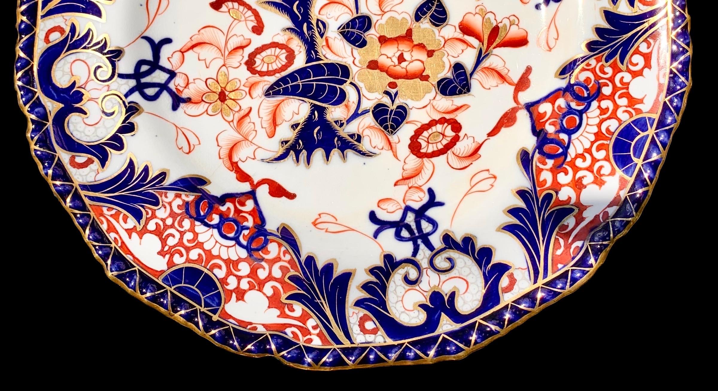 A set of six Mason's ironstone Imari Plates, early 19th century, with lovely scalloped, embossed and gilt decorated dinner plates in the typical Imari colors of red, orange, cobalt and white with leaf and floral decoration.

Set a lovely table-scape