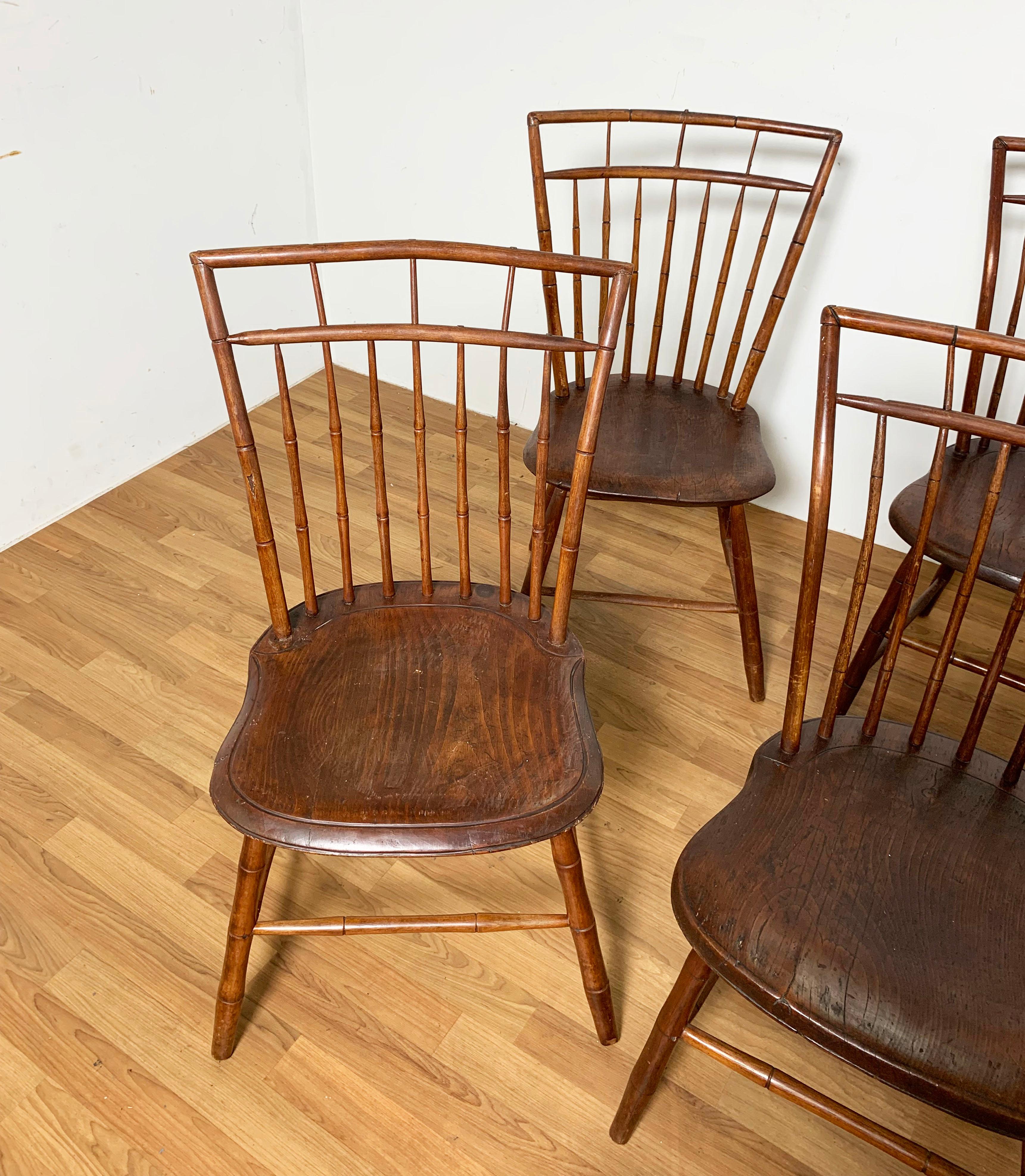 A set of six early 19th century New England birdcage Windsor chairs in cherry with carved pine seats. Several of these still bear labels from Christie’s Auction House, from where they were purchased in the 1980s. Note: one chair varies slightly in