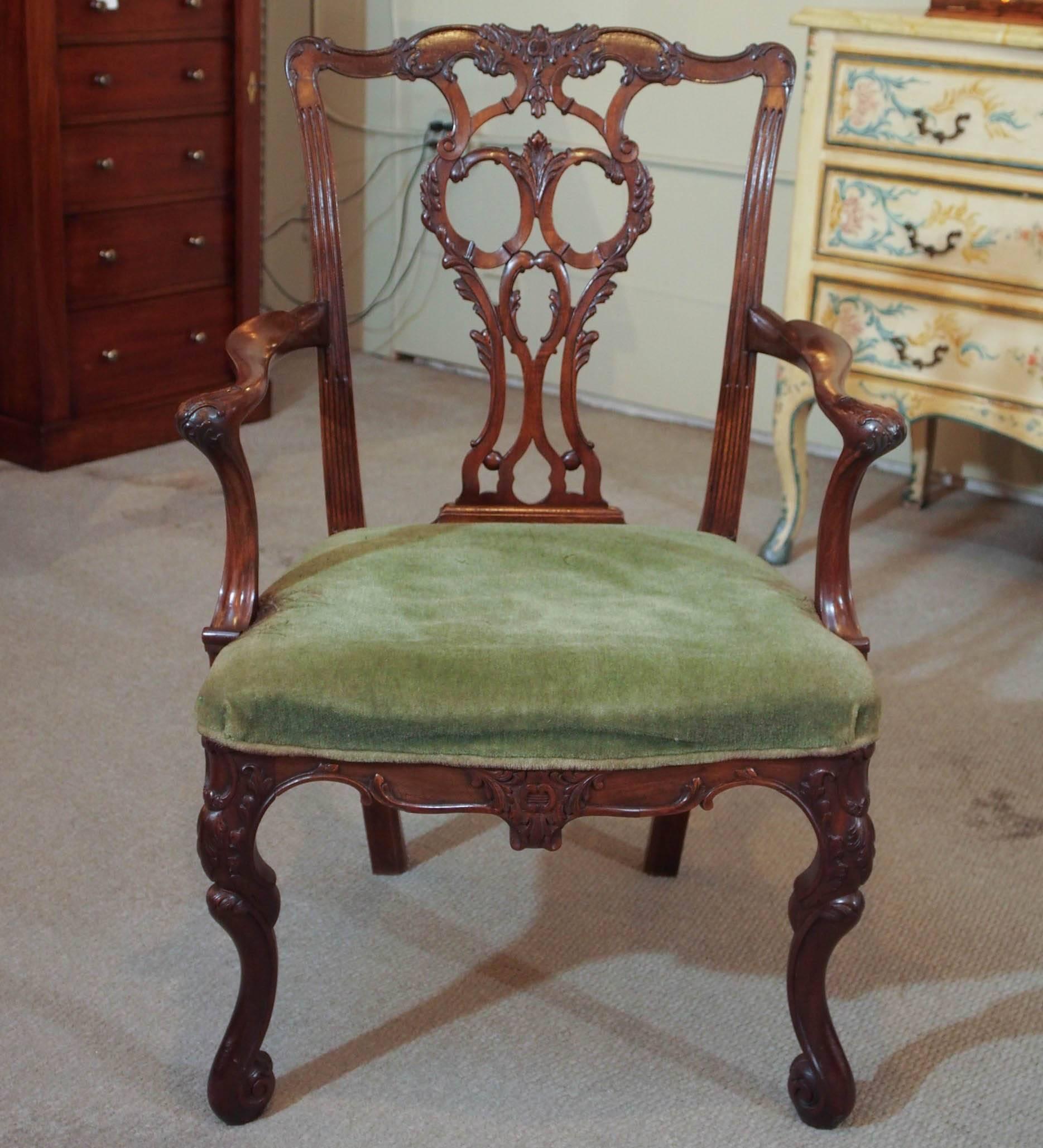 Set of six antique English carved mahogany dining chairs.