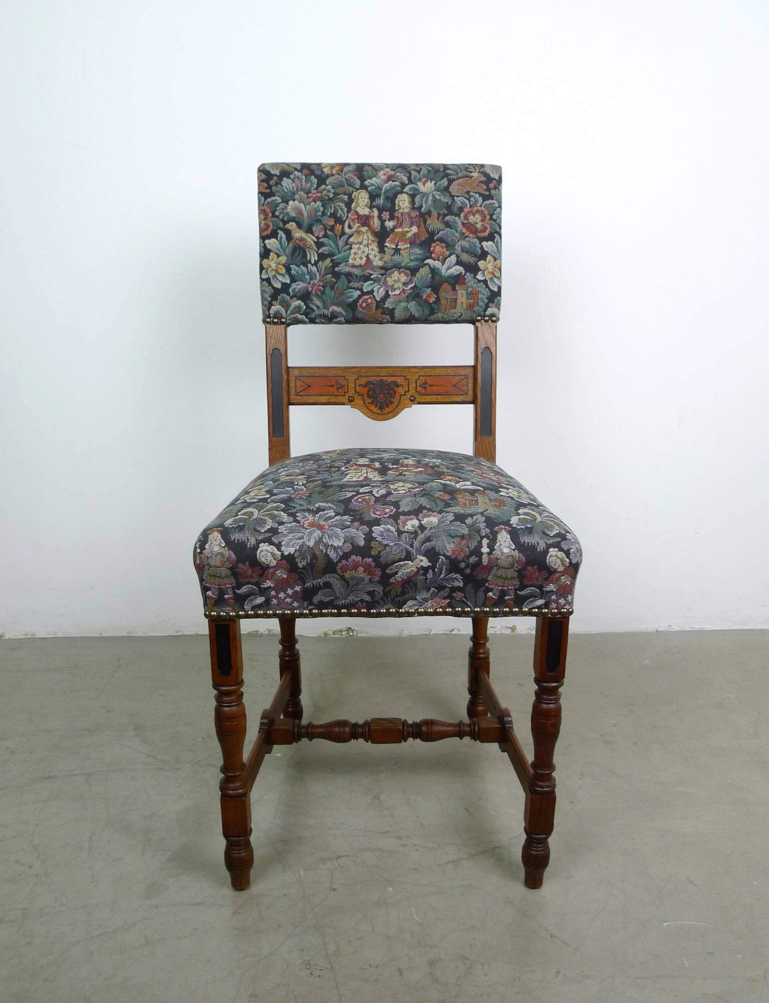 Set of six antique German dining chairs from the 1890s.
The frames of the chairs are made of dark oak. The feet and the lower traverse are elaborately shaped. The lower bands and the backrest band are additionally painted artful. The fabric shows