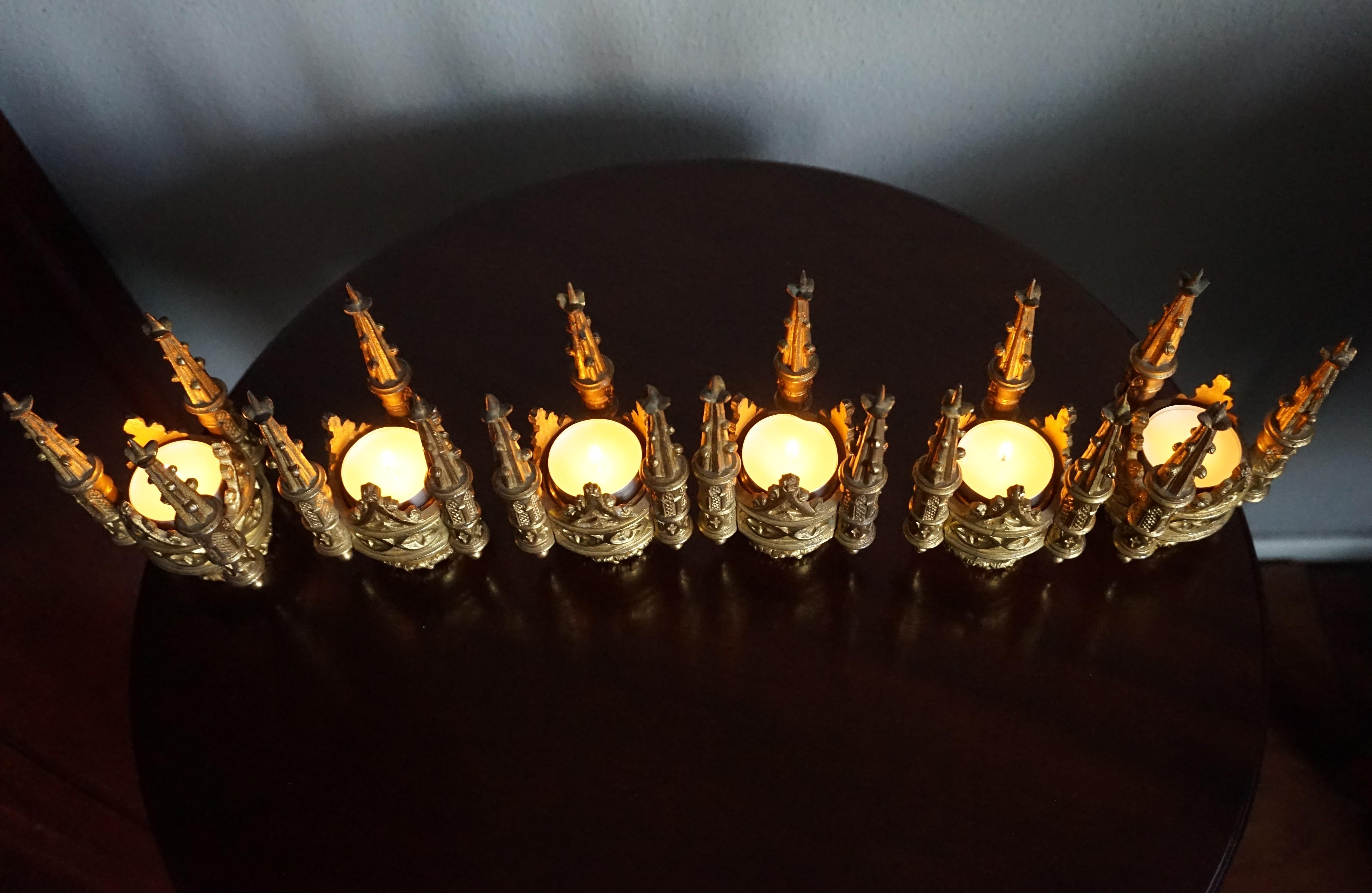 Top quality made and highly decorative Gothic candlesticks.

Especially with the holiday season coming up, you could not wish for a more beautiful and decorative set of antique candle holders. These six, 19th century solid bronze candle holders were