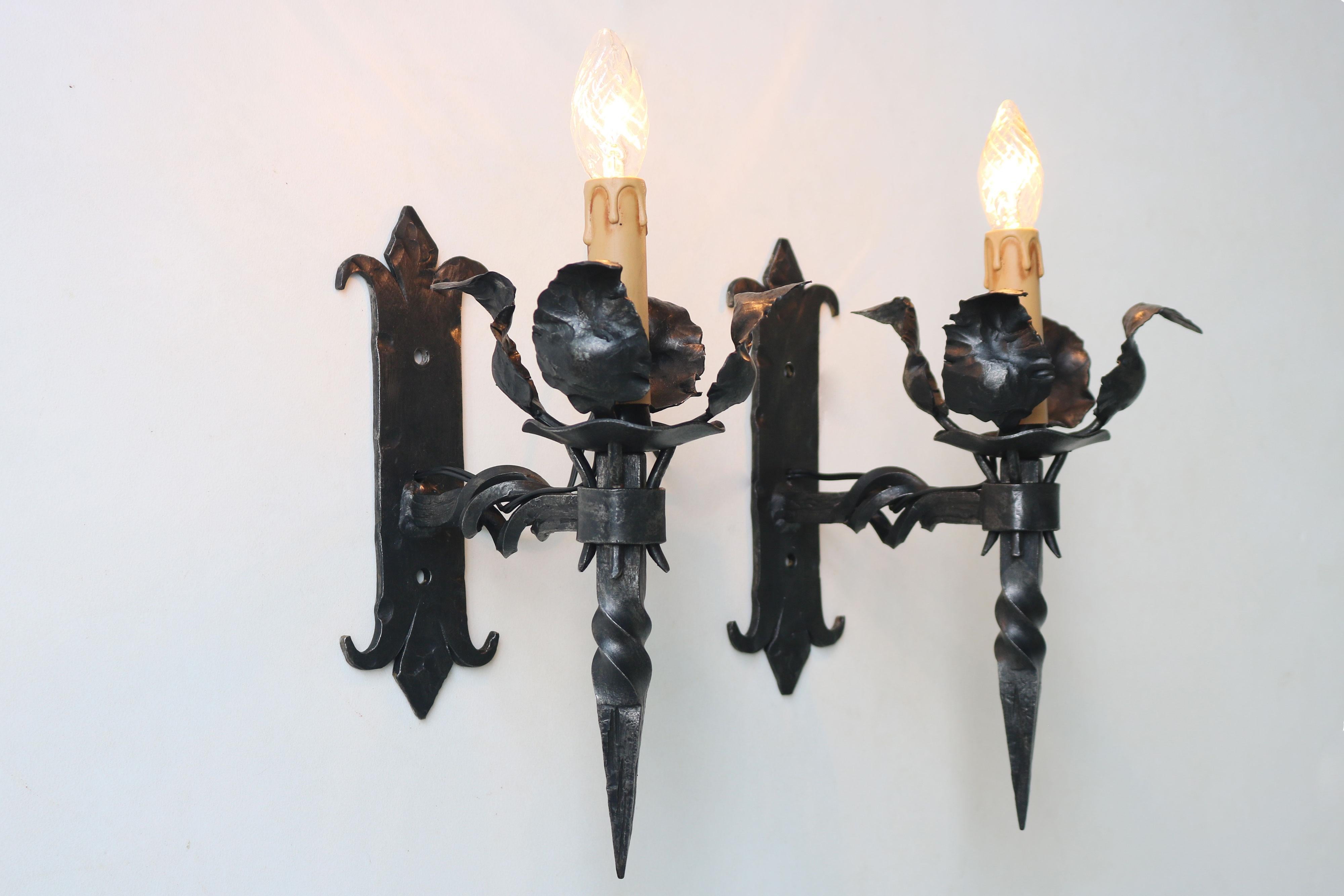 Amazing large set of six matching wall scones Spanish Gothic Revival. Fully hand crafted from wrought iron with amazing attention to detail. 
Marvelous antique metal patina. They are rewired and provide a superb Gothic feeling to any room. They look