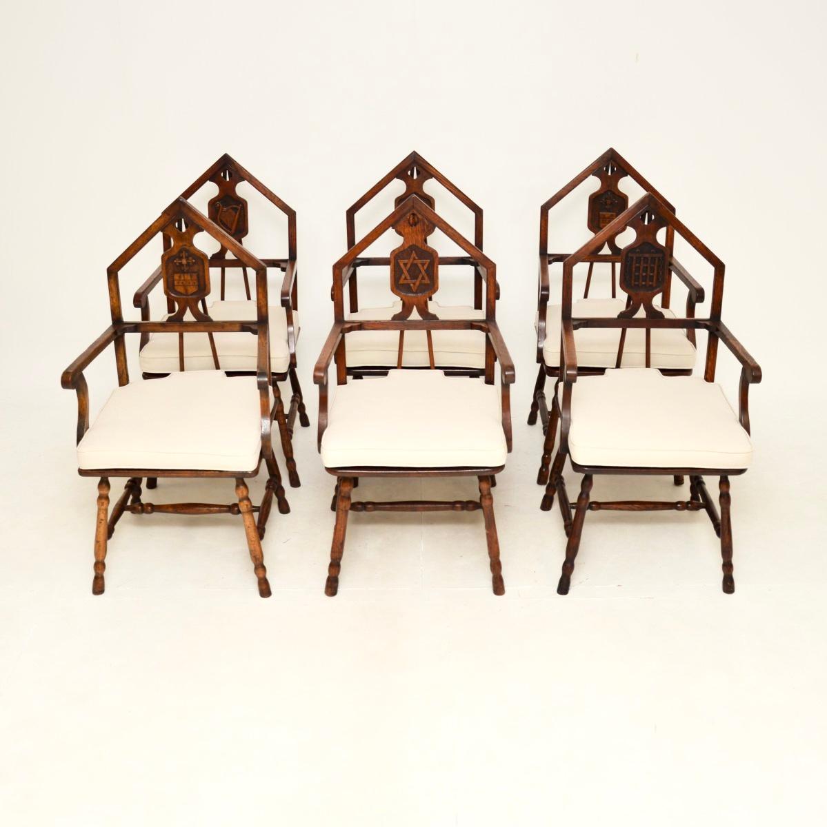 A superb set of six antique Victorian oak masonic dining chairs. They were made in England, and date from around the 1880-1900 period.

They are of superb quality and have an extremely interesting design. The back rests are arched in the typical