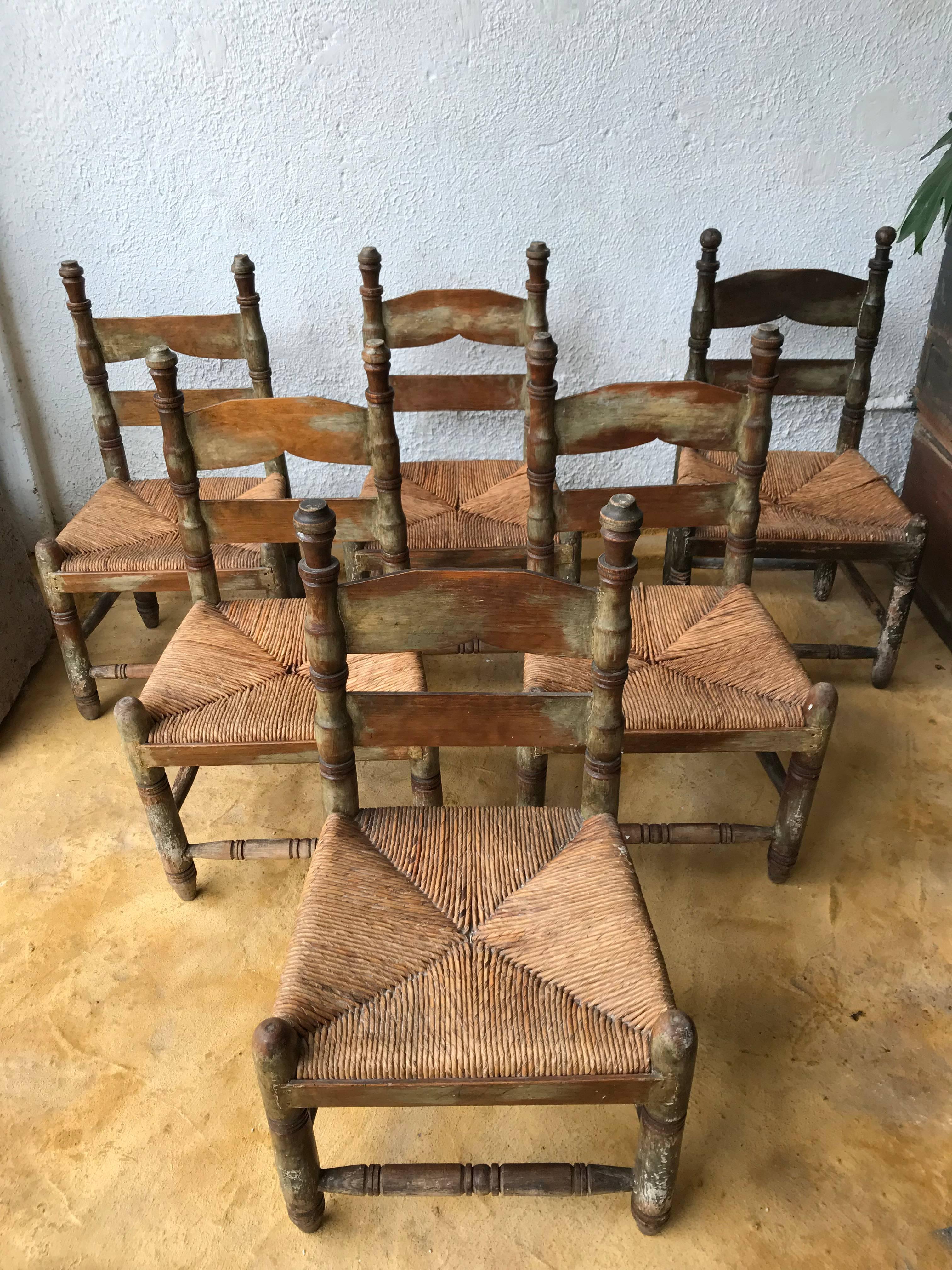 Beautiful set of six beautiful antique wood chairs found in Central México. 
The structure is made with turned pinewood, the seating is weaved Tule.
This type of chair was very popular during the early years of the 20th century in small towns or