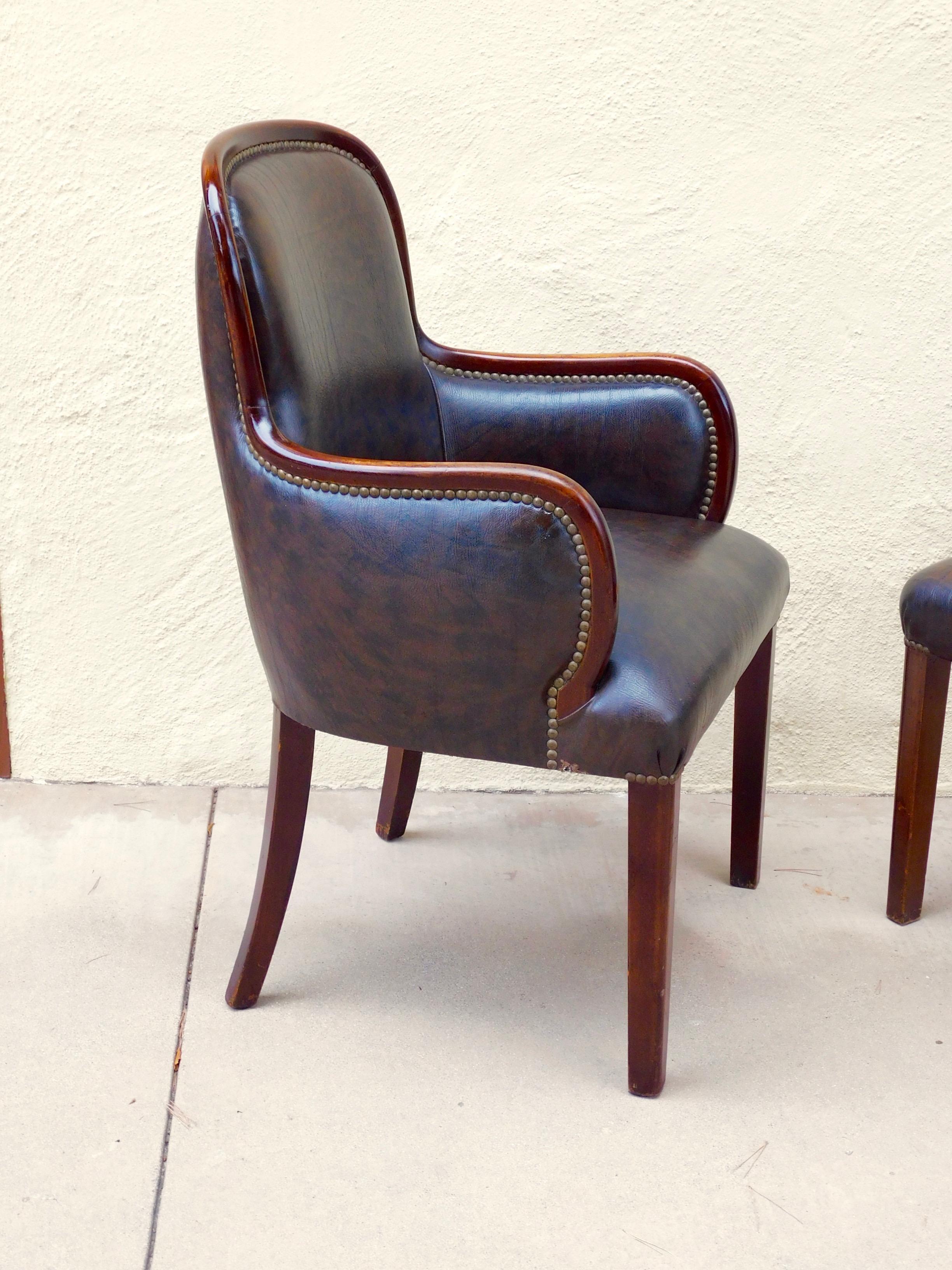 Set of six Argentine art moderne dining chairs, circa 1940.
Two captains chairs and four side chairs.
In mahogany with oak legs.
In very good original condition. Some wear is visible on the wood.
With original synthetic fabric in very good