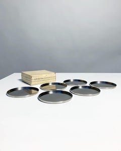 Set von sechs Arne Jacobsen Untersetzern Stelton in Schachtel Edelstahl Dänemark, 1970