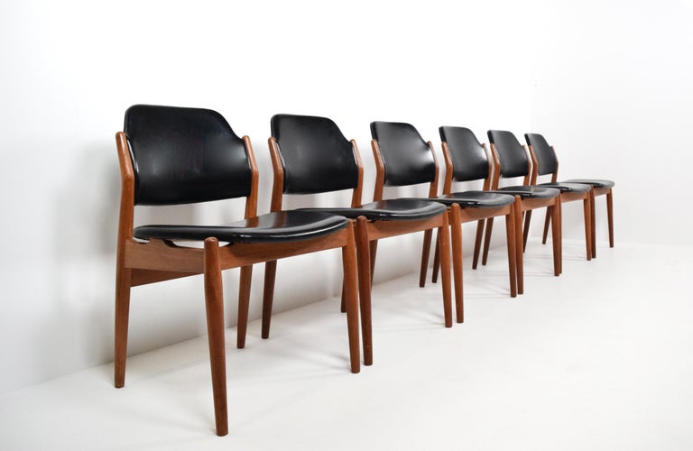 Great Set of Arne Vodder dining chairs Model 462 for Sibast Furniture, Denmark, 1960s. These chairs are made of teak with faux leather. The design is modest, yet very modern with the shapes used in the back of the chair. They are a great example of