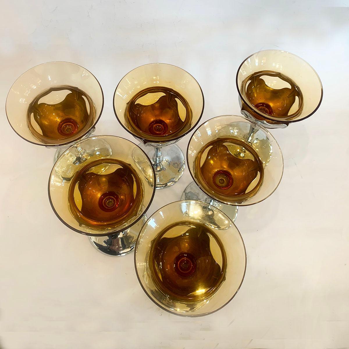 Set of six Cambridge glasses on Farberware chrome filigree stems. The specialty of these glasses is the patent for the design, where the chromed or nickel stem, grips the upper glass; when it comes to washing, the metal is removed and the glasses