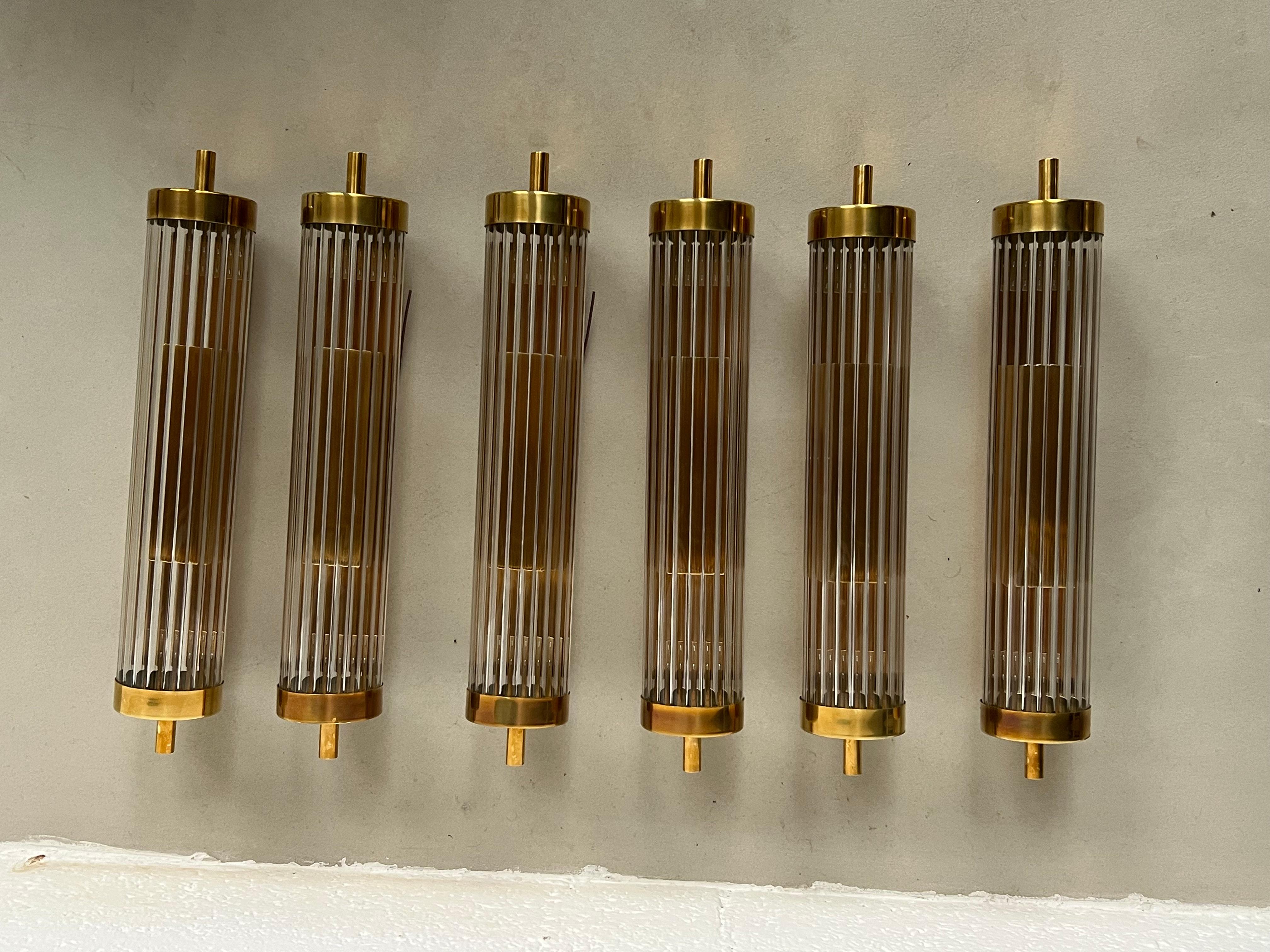 Wall lamps Applique for Vanity or Wall Sconces - Modern Mid Century Italian Lighting - Flush mount

Offered for sale is a set of four stunning contemporary wall lights, designed and hand crafted in Milano, Italy by expert artisans using brass and