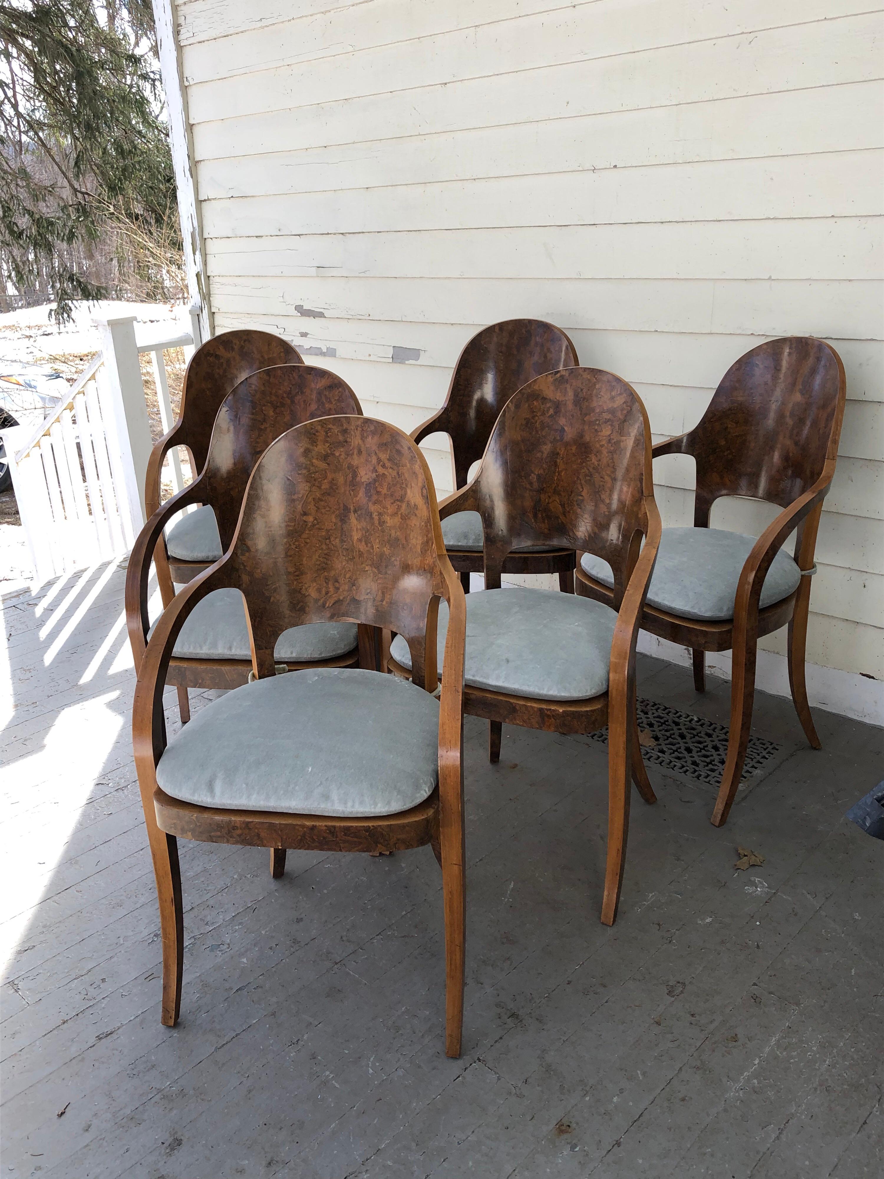 Set of six Austrian or Italian walnut dining room armchairs with tie-on loose
seat cushions- upholstery blue/grey velvet, with velcro fasteners. Wonderful curved back and elegant sabre legs. Probably from the 1940s. From the Estate of Jan Cowles.