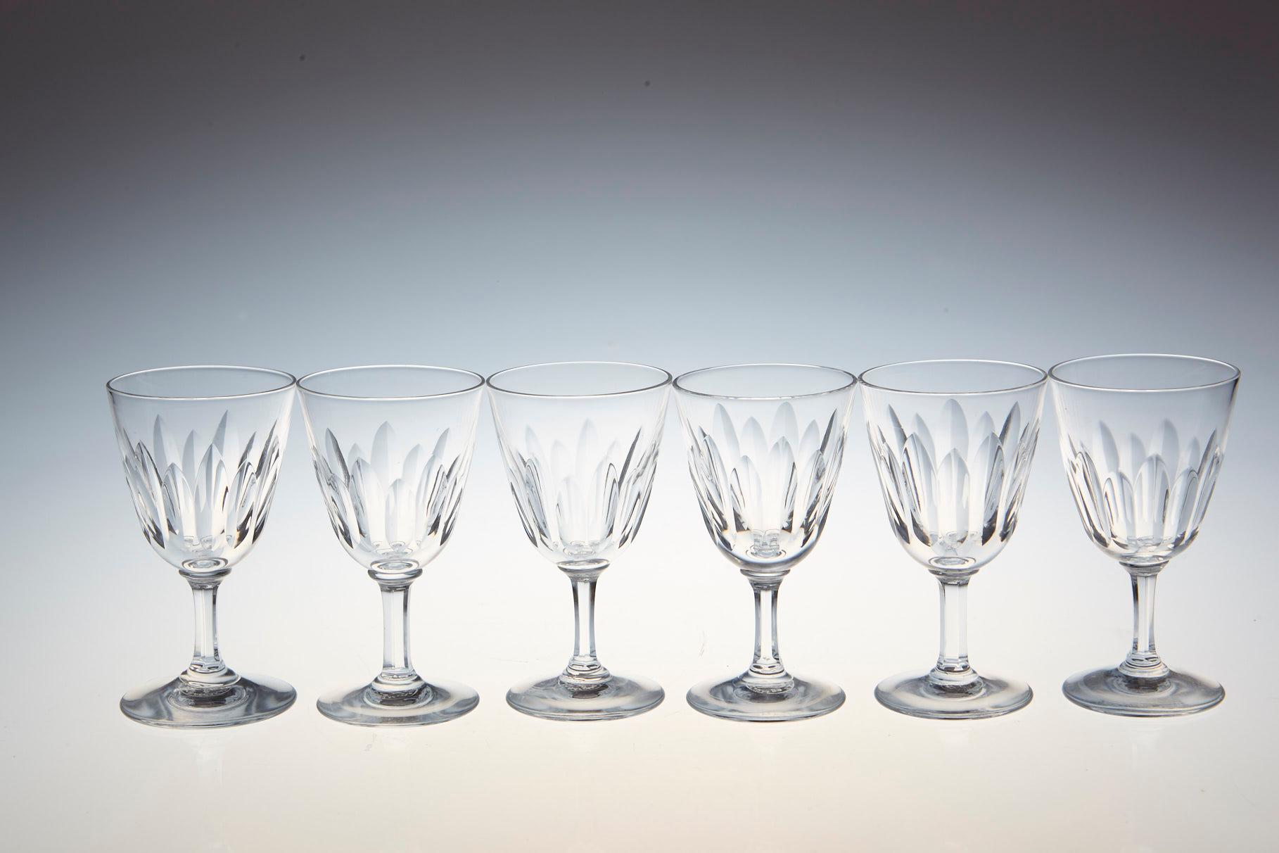 Rare set of six Baccarat crystal sherry or port glasses in the 'Verone' pattern. The glasses are in a vertical cut bowl form with a six sided stem. This pattern was manufactured between 1954-1961.
The glasses are in a very good condition.