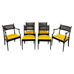 Set of Six Baker Furniture Regency Ebonized and Parcel Gilt Cane Dining Chairs