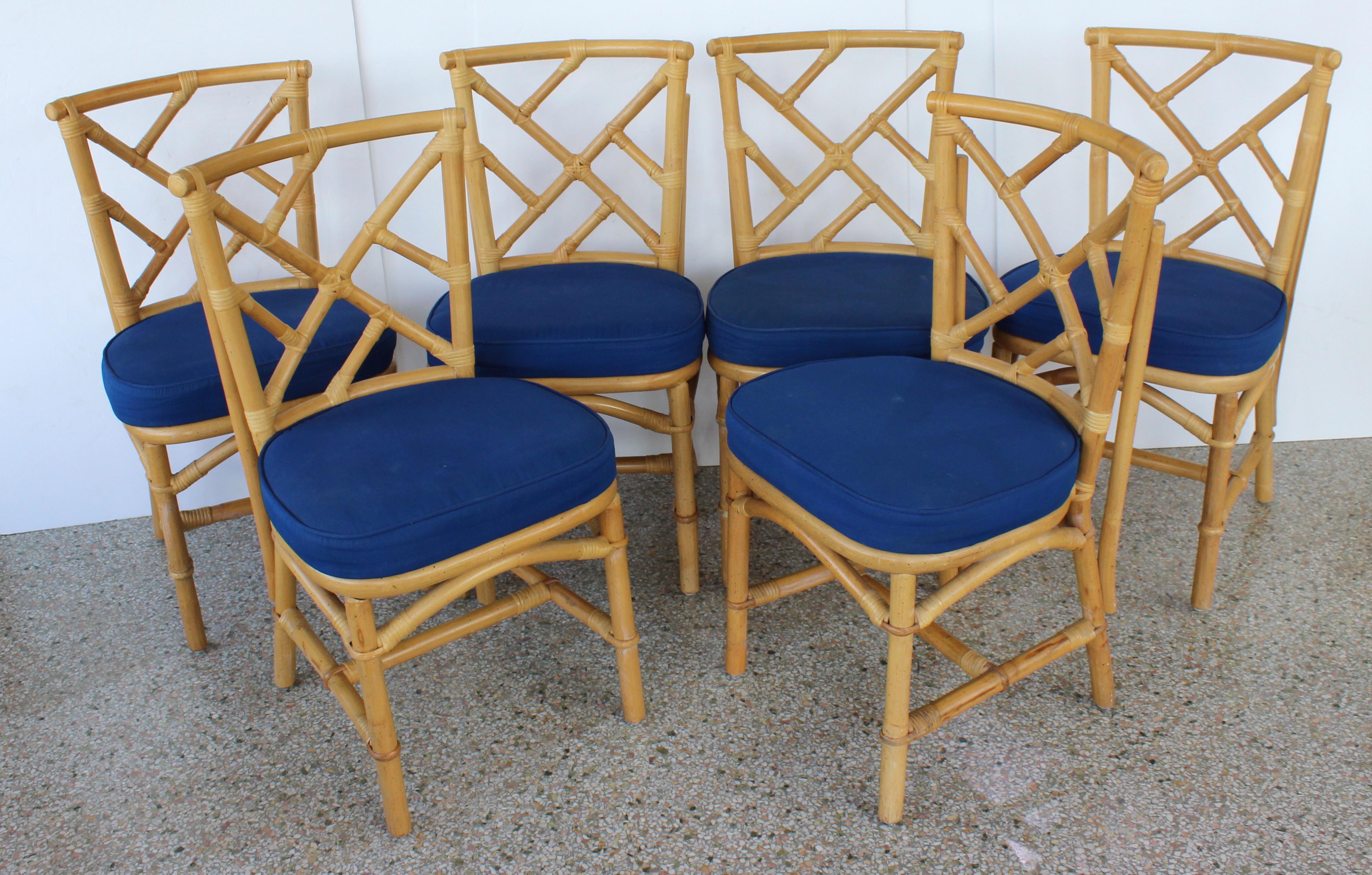 This set of four bamboo side chairs were acquired from a local Palm Beach club, and are of commercial quality, with sturdy frames. 

Note: All of the four Sunbrella upholstered seat cushions show signs of wear and soiling, and were recently