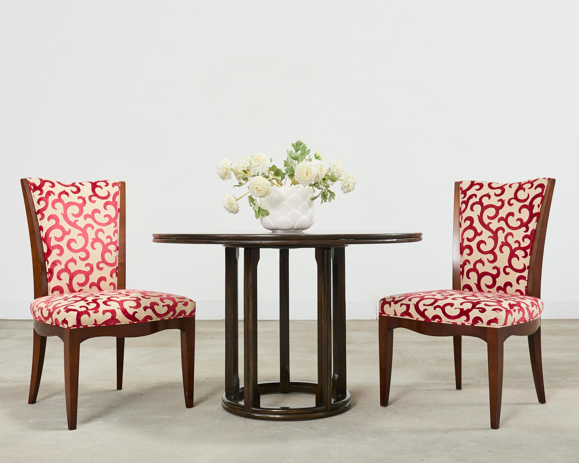 Fantastic set of six mahogany framed dining chairs designed by Barbara Barry for Baker Furniture. The chairs feature a whimsical cut velvet upholstery with a festive jewel toned ruby red scroll design that resembles red coral over the beige ground.