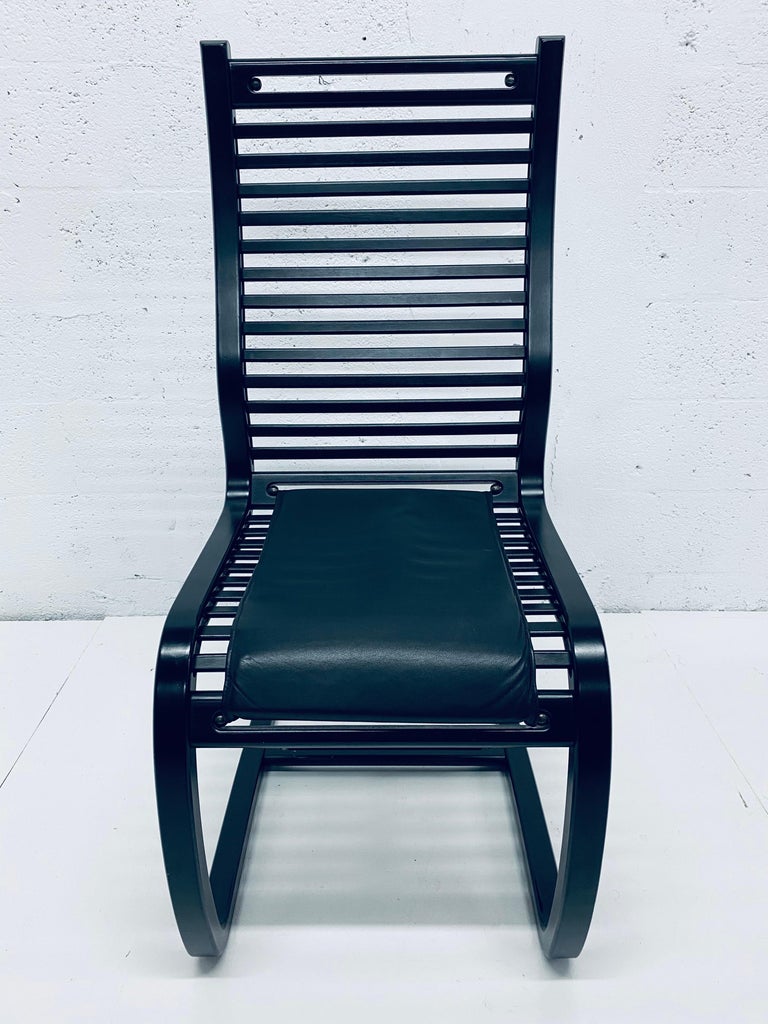 Six ebony stained wood slat cantilevered dining chairs with black Naugahyde cushions designed by Terje Hope for Westnofa, 1980s.  Very comfortable design based on the Bauhaus / Art Deco and Memphis Milano period.