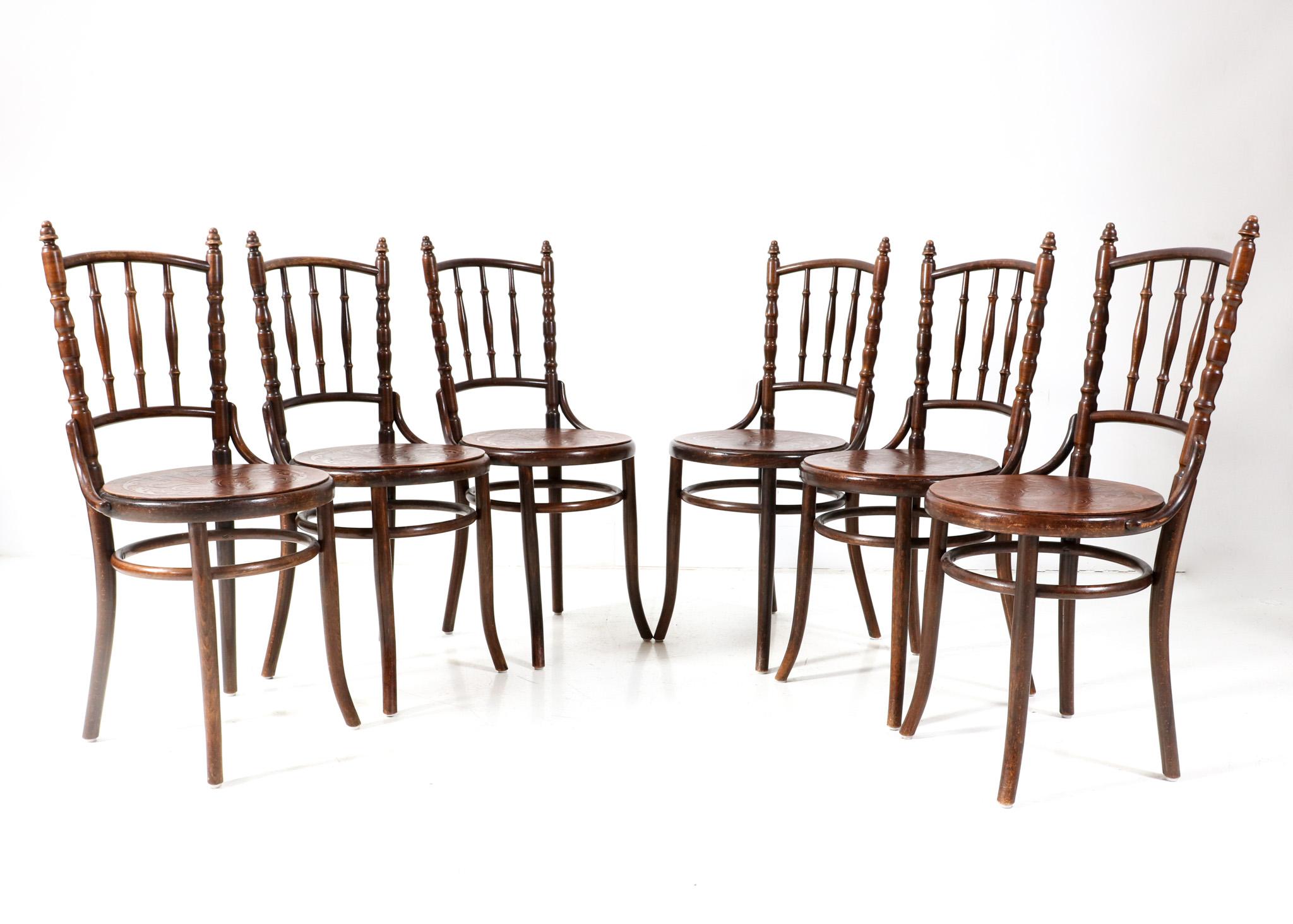 Set of six Art Nouveau bistro chairs.
Design by Fischel Austria.
Striking Austrian design from the 1900s.
Solid beech and bentwood frames with original printed wooden seats.
This wonderful set of six Art Nouveau bistro chairs by Fischel Austria is