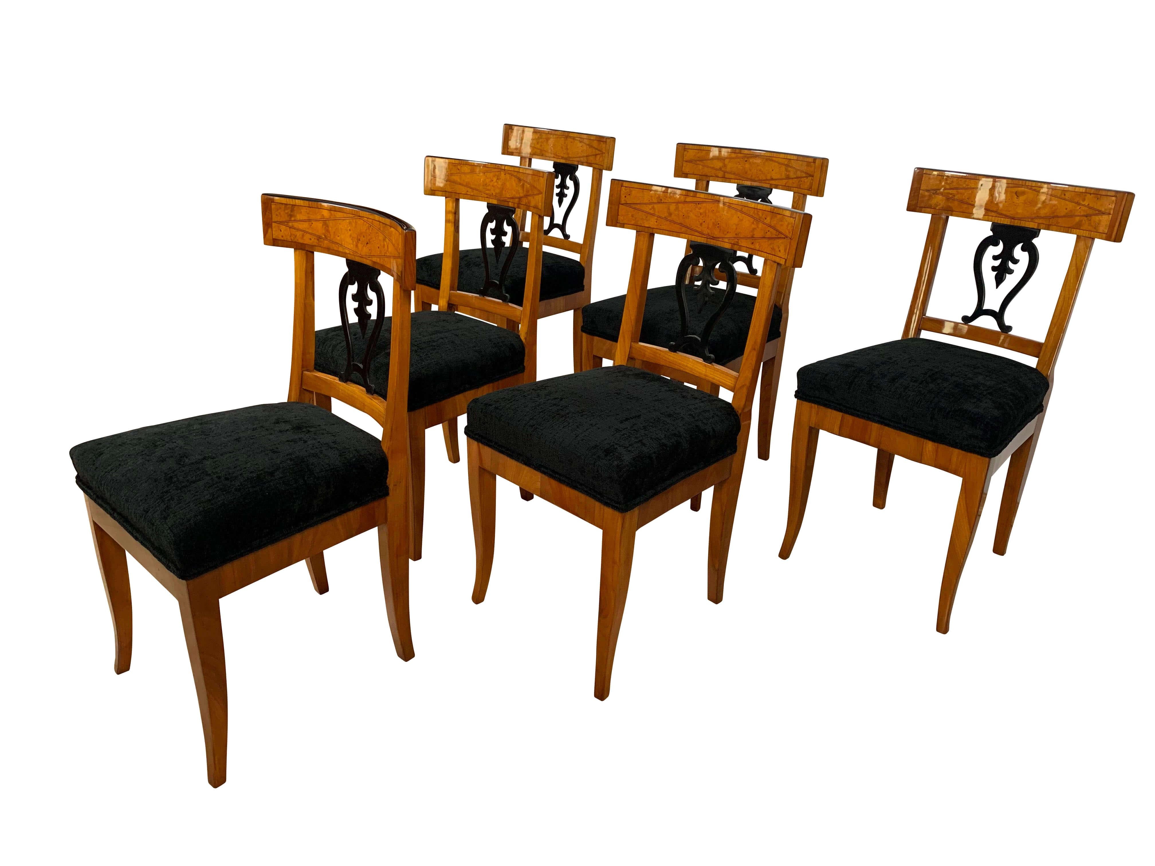 Beautiful set of six original, neoclassical early Biedermeier chairs from Thuringia, Germany, circa 1820.

Cherrywood veneered and solid, inlay on the backrest made with ash root veneer, maple and pear (?).
Lovely ebonized back decor and ebonized