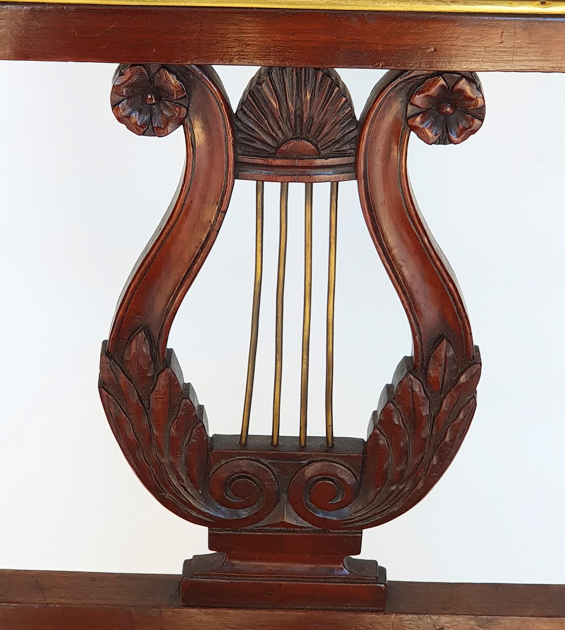 Set of six Biedermeier lyre chairs, Northern Germany, 1820s. Made of mahogany. Very good, original condition.

Conical square legs on the front, square legs on the back. Straight chair frame. Upholstery and upholstery are original. The upholstery