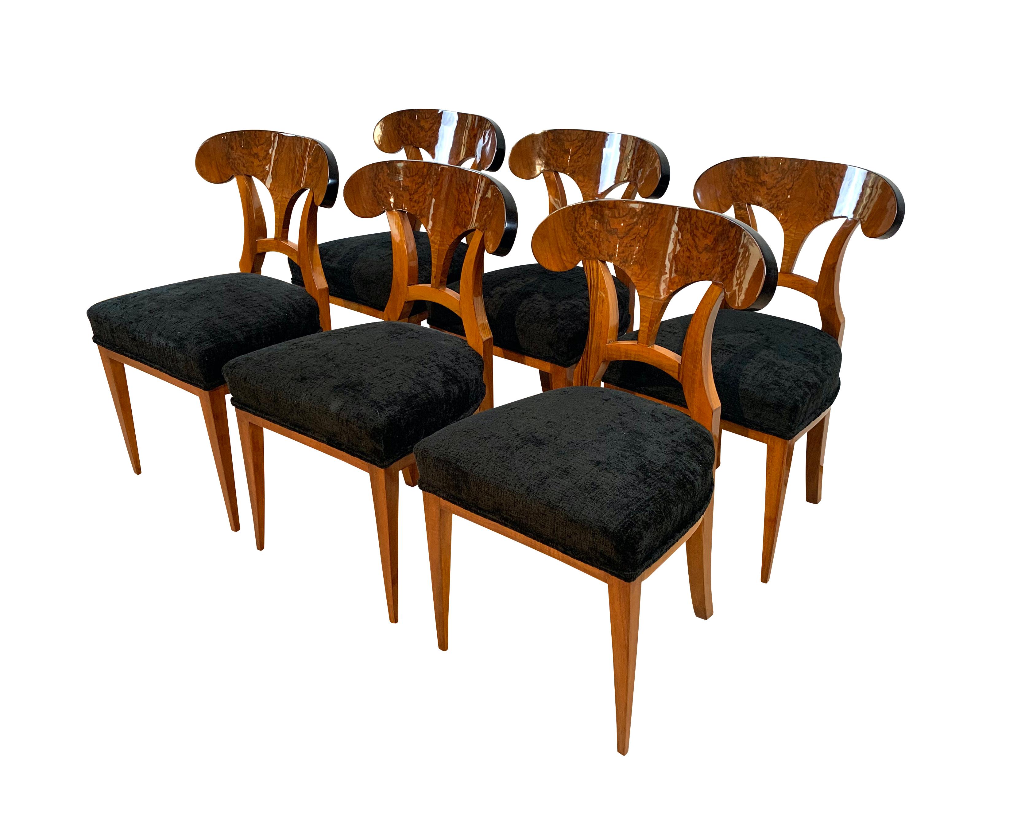 Set of six antique neoclassical Biedermeier shovel chairs from South Germany circa 1860.

Book-matched walnut veneer and solid wood. Hand-polished with shellac (French polish). 
The chairs are from the second half of the 19th century (so called