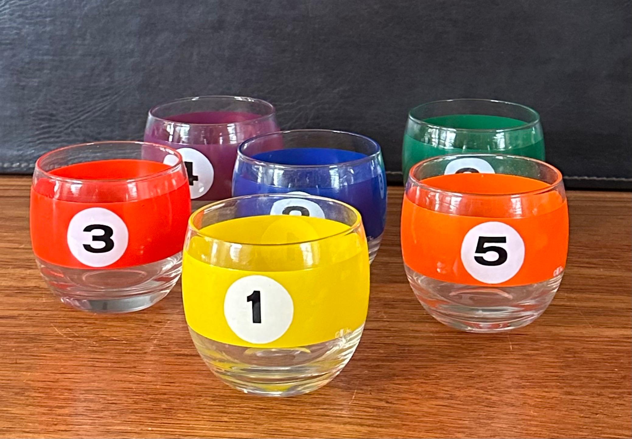 Great set of six billiard / pool balls roll poly cocktail glasses by Cera, circa 1970s. Each glass resembles a billiard ball with a number and colorful stripe. These glasses are very difficult to find in a set and are numbered 1 through 6; they are