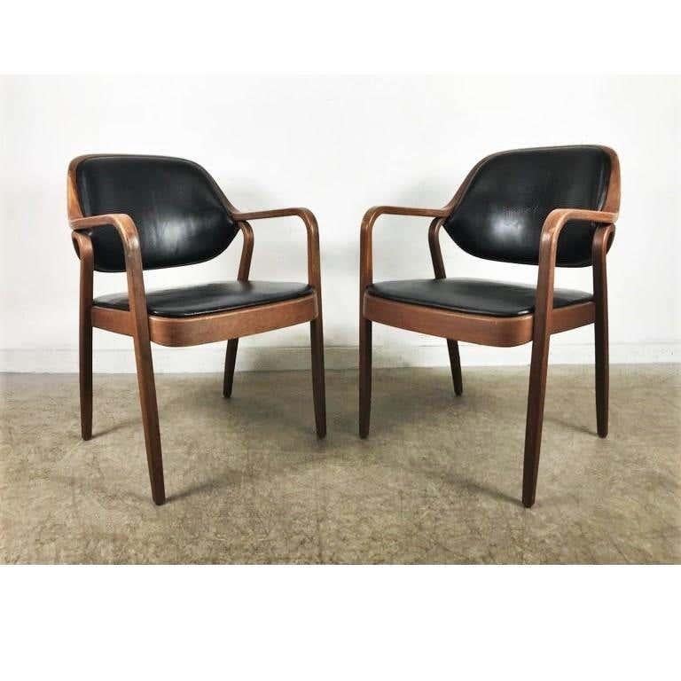 Set of six black Don Petitt Bentwood armchairs for Knolla Bentwood armchairs by Don Petitt for Knoll. Two lengths of pressed and bent layers of sculpted wood make up the legs and arms as well as the seat back frames. Chairs feature black upholstery