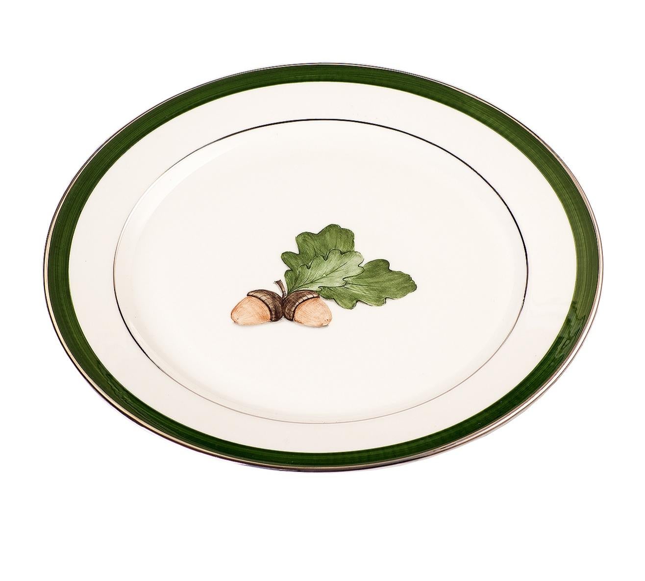 Set of six completely handmade and hand painted under glaze porcelain soup plates. The decor shows a black forest hands-free painted oak leaf with a green hands free line and platinum rimmed.
The painting is dishwasher safe but not the platinum