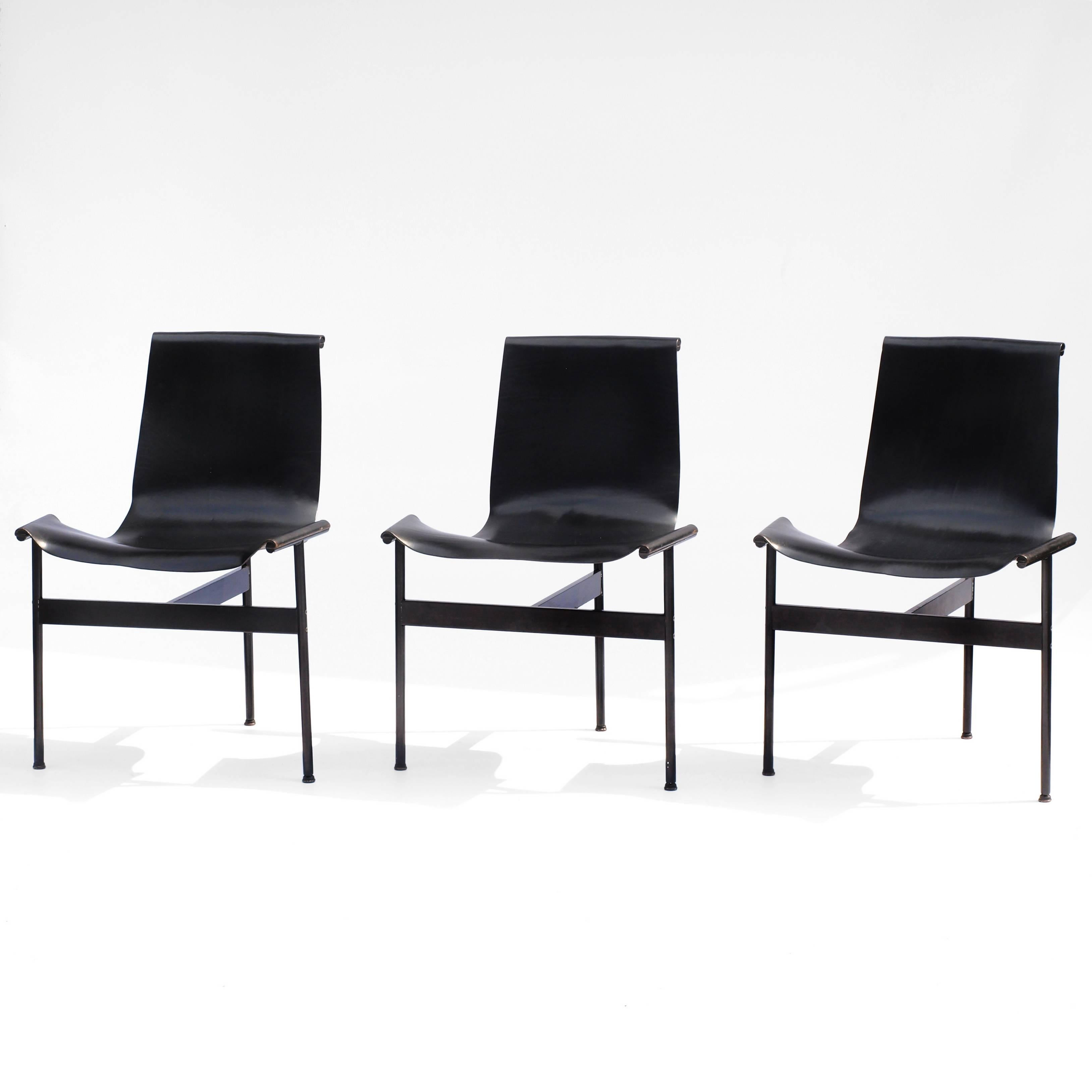 A set of six sling-back t-chairs from the 1960s by William Katavolos, Ross Littel and Douglas Kelley for Laverne International. 

These highly engineered chairs are constructed on a steel frame in the shape of a T and finished in black enamel and