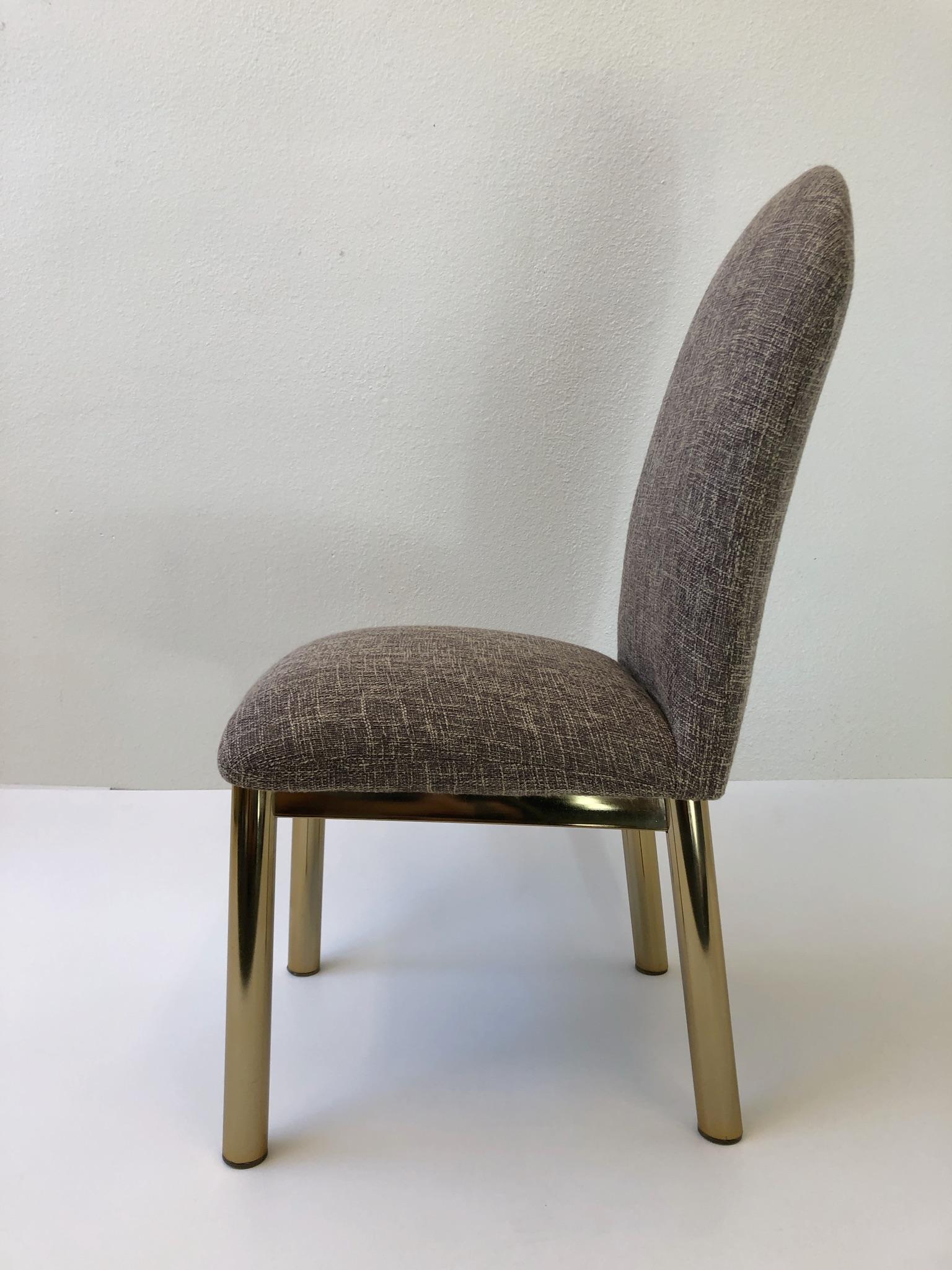 A glamorous set of six dining chairs from the 1970s. The chairs have been newly recovered in a beautiful light brown tweed fabric. The brass legs are in original condition, so they show minor wear.
Dimensions: 20” Wide, 24” deep, 39” high, 19”