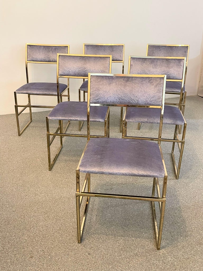 Vintage set of six brass-plated chrome chairs, designed and manufactured in Firenze Italy in the 1970s.
 The dining chairs are made of square metal tubes that create a comfortable and sophisticated construction. 
The upholstery is covered in new