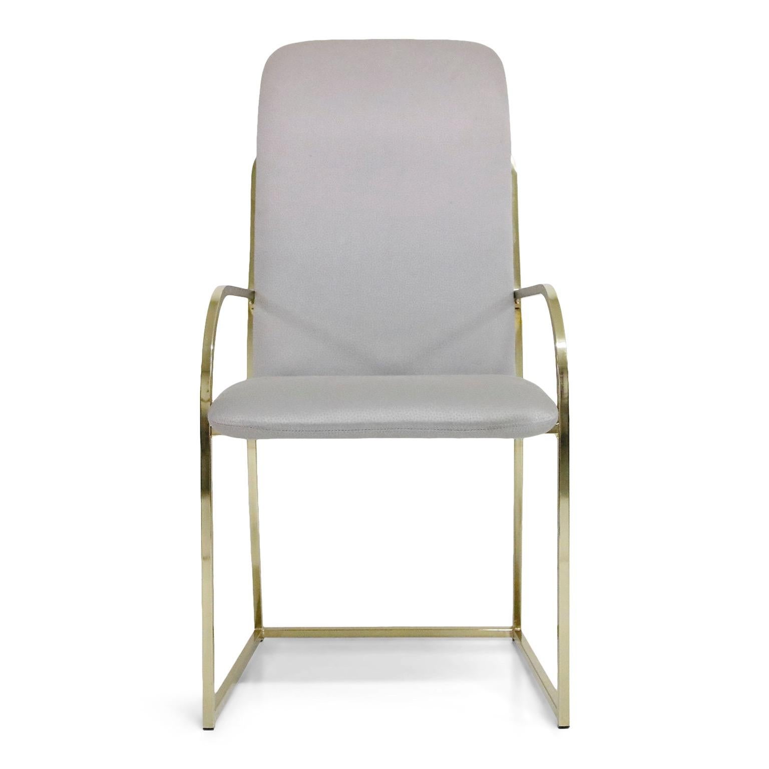 This set of six (6) brass dining chairs are by Design Institute America and labelled underneath each chair. Two (2) captains armchairs and four (4) side chairs. Nice bright and clean brass with sculptural lines make this set an excellent candidate